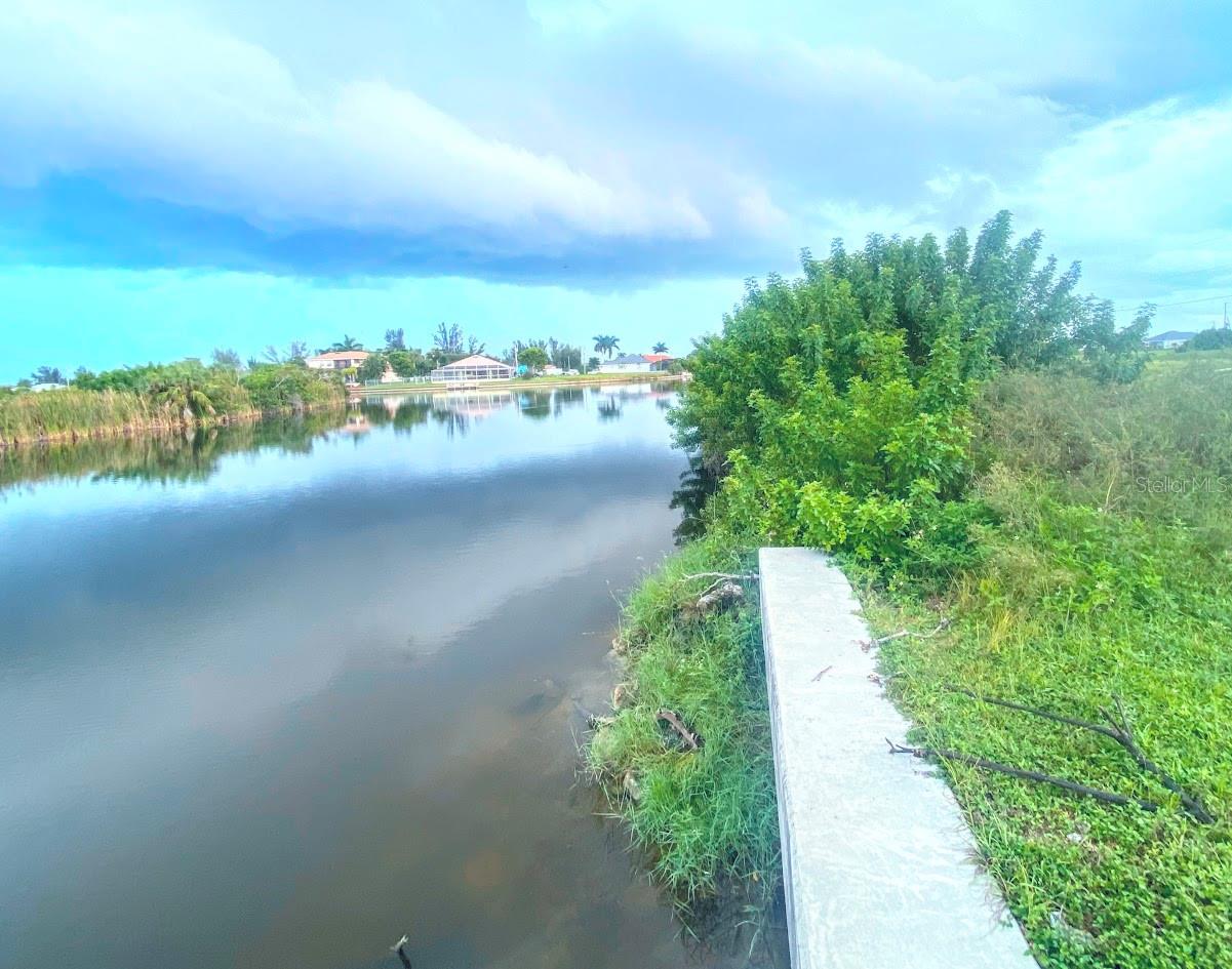 Discover this waterfront 0.24-acre lot in the heart of NW Cape Coral, offering endless potential to build your dream home, free from HOA's.