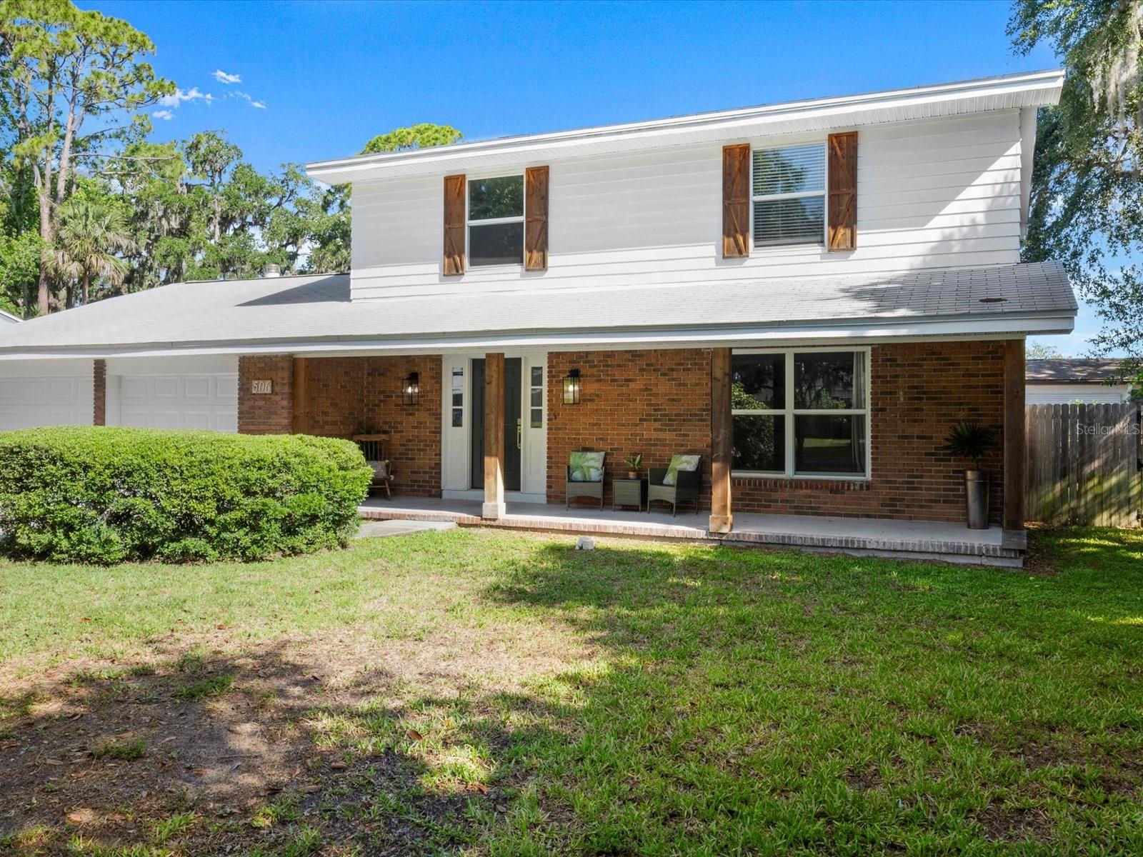 Nicely updated 4 BEDROOM POOL HOME close to Daytona State and Embry-Riddle! Perfect for a growing family or a great investment for student housing. Situated on a quiet, beautifully tree lined street, this brick home's front porch, accented with natural wood pillars, has the warmth of the colonial style of years gone by with a modern touch of today. As you come through the front door, the traditional touches are still there, however, the updated floors, kitchen, and baths bring the classic elements into a fresh modern style. The updated kitchen features a breakfast bar and breakfast nook and is open to the lovely family room with a full wall white, brick fireplace. At the opposite end, the kitchen flows to the lovely dining room and large living room, which again are separate but open. The abundance of windows keeps this house bright, and whether pool or nature, every room has a view! The main floor also includes your indoor laundry and a half bath for guests. Just beyond the Family Room sliders, step on to the covered patio in your fully fenced backyard and see your own private, recently resurfaced, sparkling pool with jacuzzi. Upstairs you will find the main ensuite with its own updated bath, 3 more generous size bedrooms and a second updated full bath. The roof was replaced in 2020, and both HVAC units were replaced in 2022 along with the windows and water heater. Square footage received from tax rolls. All information intended to be accurate but cannot be guaranteed.