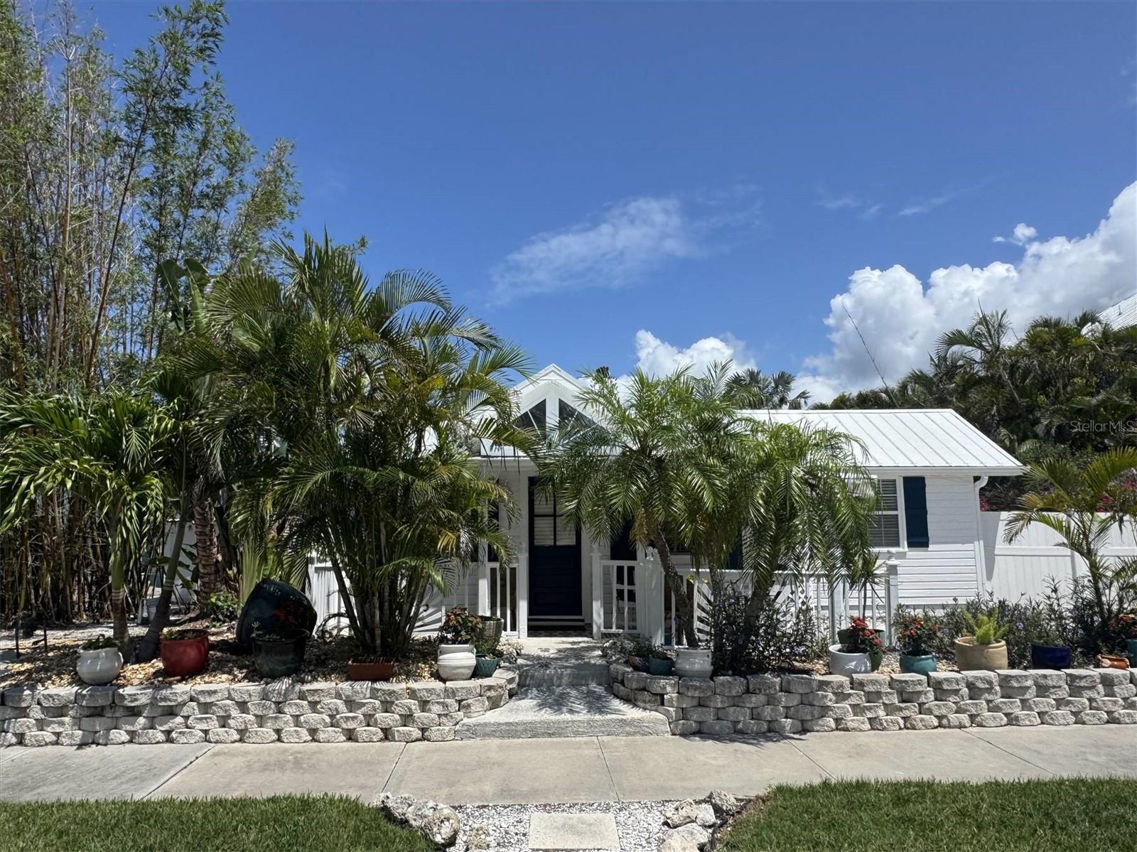 Newly remodeled bungalow blocks from Whitney Beach & a block from bay. Historic home was once a post office in the 1920's. Open layout w/high ceilings, stainless appliances w/ gas stove. Heated swimming pool & hot tub. Relax & listen to breezy palms smack up against each other in this gorgeous landscaping! Sleep tight in a quiet neighborhood that allows zero public parking. Very serene, private fenced-in property - what happens here, stays here! Boat parking & convenient to public water access. Walk to Mar Vista, or join the fun in St. Armand's. Available furnished, for a 28 day minimum, sleeps 6 in king/king with 2 closets in each room & a cozy queen sofa.
