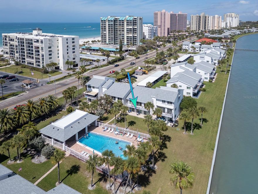 Water Views, Dolphin Sightings & Steps to Sand Key Beach — Completely Remodeled Turnkey Condo that Checks Every Box!   Beautifully renovated, impeccably maintained, and fully turnkey, it lives like a designer model home in one of Clearwater Beach’s most desirable locations. Welcome to Bayside Gardens, a waterfront community on gorgeous Sand Key just moments from the Gulf of Mexico.  This light-filled 2-bedroom, 2-bath ground-floor residence features an open living area highlighted by three large hurricane-rated sliders that open to a spacious covered patio overlooking the pool and sparkling Intracoastal Waterway. Enjoy watching dolphins glide by while relaxing in your own private waterfront retreat. The home has been thoughtfully upgraded with brand-new designer furnishings, electric blackout window treatments, and a new A/C system, creating a space that feels pristine, polished, and like-new.  The interior showcases tasteful coastal décor, tile flooring throughout, beautifully updated bathrooms, and an inside laundry room with a full-size washer and dryer. Both bedrooms feature generous wall-length closets, providing ample storage.  Covered parking space #1 is conveniently located near the front door. The Bayside Gardens community offers a large waterfront pool, picnic area with grills, and stunning Intracoastal views. Launch your kayak or paddleboard just outside your door, or take the short walk to Sand Key Beach, located right next to the building.  Bayside Gardens is pet friendly, allowing two pets, and permits 90-day minimum rentals with no ownership waiting period, making this an exceptional primary residence, beach retreat, or investment opportunity.  Enjoy the nearby Shoppes at Sand Key, waterfront restaurants, boutique shopping, and Sand Key Park. World-famous Clearwater Beach is just over the Sand Key Bridge. With its prime Sand Key location, beautiful updates, and exceptional pricing, this is a rare opportunity to own a turnkey waterfront condo. Schedule your private showing today!