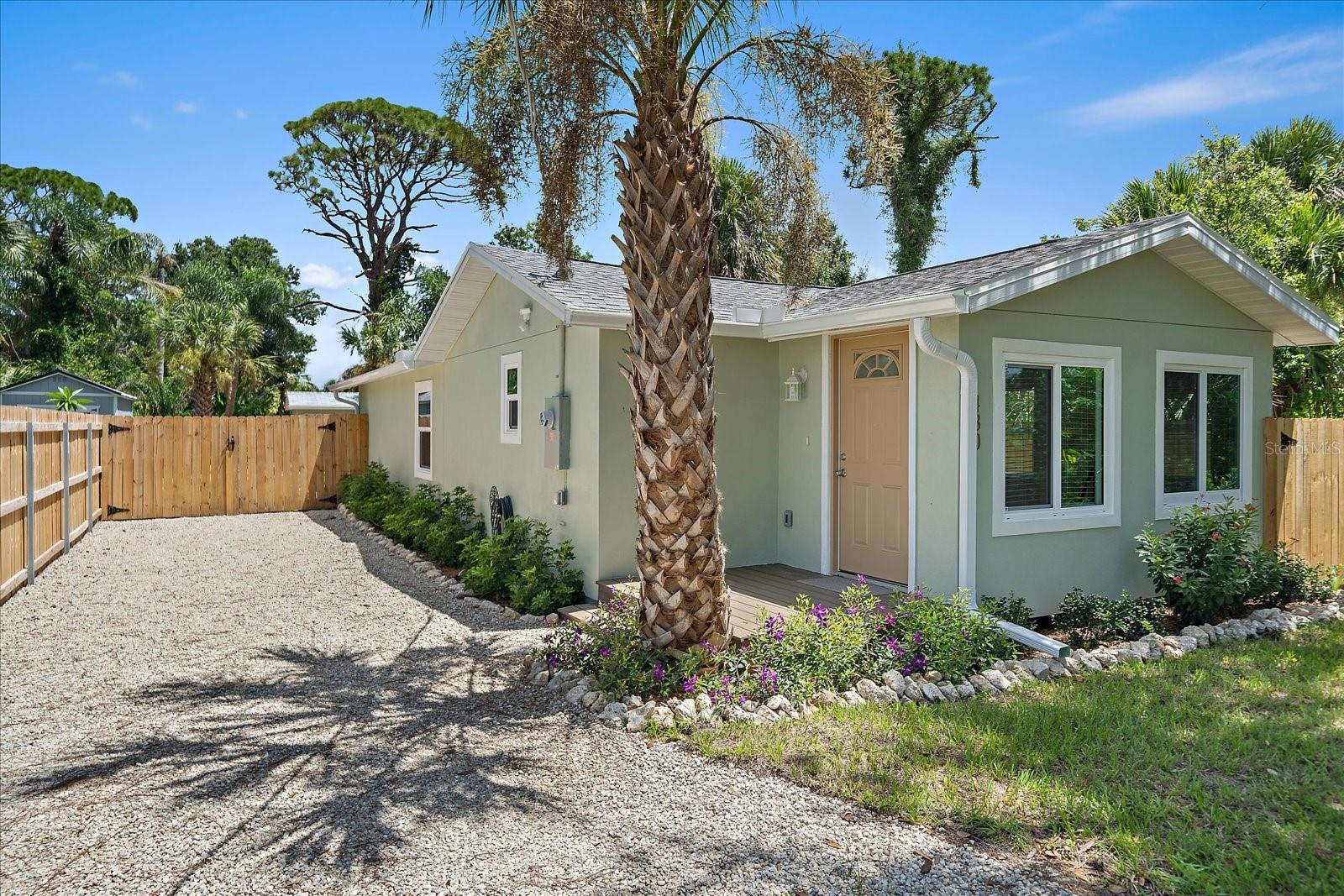Completely renovated 2-bedroom, 1-bathroom home offering modern updates and peace of mind. Everything has been redone including new wood framing, new lath, and a moisture barrier for long-lasting durability, structural integrity, and peace of mind. The open-concept interior features luxury vinyl plank flooring, granite countertops throughout, and a cozy electric fireplace in the main living area. The stylish kitchen includes all brand-new appliances, such as an induction stove, refrigerator, dishwasher, built-in microwave, tankless water heater, and stacking washer and dryer. The bathroom showcases elegant shellstone flooring and updated fixtures with a standing shower. This home also features PGT hurricane impact-rated windows throughout, a 2019 roof, new electrical and plumbing (PEX) systems including new plumbing from the sewer to the street - all designed for efficiency, safety, and comfort. Step outside to enjoy a spacious, private backyard with a powered shed, perfect for storage, hobbies, or a workshop setup. Located in an X flood zone, this home has public water and sewer, no HOA, and offers easy access to the best of Englewood. Just 1 mile from shopping & dining, 6 miles from Englewood Beach and minutes from Boca Royale Golf & Country Club, Lemon Bay Park, and Buchan Airport Community Park, this property is ideal for full-time residents, snowbirds, or seasonal investors looking to enjoy the Florida lifestyle.