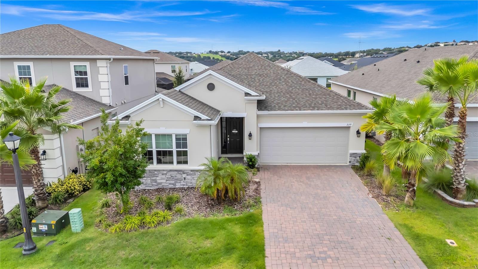 This gorgeous 4 bedroom/3 bathroom, 2 Car Garage home in one of Clermont’s most sought-after communities- HIGHLAND RANCH! Perfectly positioned near the Olympic Training Center and just 10 minutes from the new Costco, With thoughtful upgrades and modern finishes throughout, this home is a true masterpiece tailored for today’s lifestyle. To the left, you’ll find a versatile office space—perfect for remote work or creative projects—along with a second bedroom featuring a full bath, ideal for family or guests. At the heart of the home is the chef’s kitchen, featuring a striking quartz island, built-in double ovens, gas stove, and upgraded refrigerator. Designer tile backsplash, 42-inch cabinets, and wood-look tile flooring combine style with practicality. A spacious walk-in pantry and generous breakfast bar overlooking the family room complete the open-concept layout—perfect for both everyday living and entertaining.The owner’s suite is privately tucked away, offering a serene retreat with an oversized walk-in closet, a spa-inspired ensuite bath, and a layout designed for ultimate comfort and relaxation. The Highland Ranch Community is amazing with resort style amenities that includes a huge pool, splash pad, playground, basketball court, fenced dog park, fire pit, and volleyball court! Close to Turnpike, shopping & more, this Home & Community will be your perfect Florida Home! Schedule a showing today!