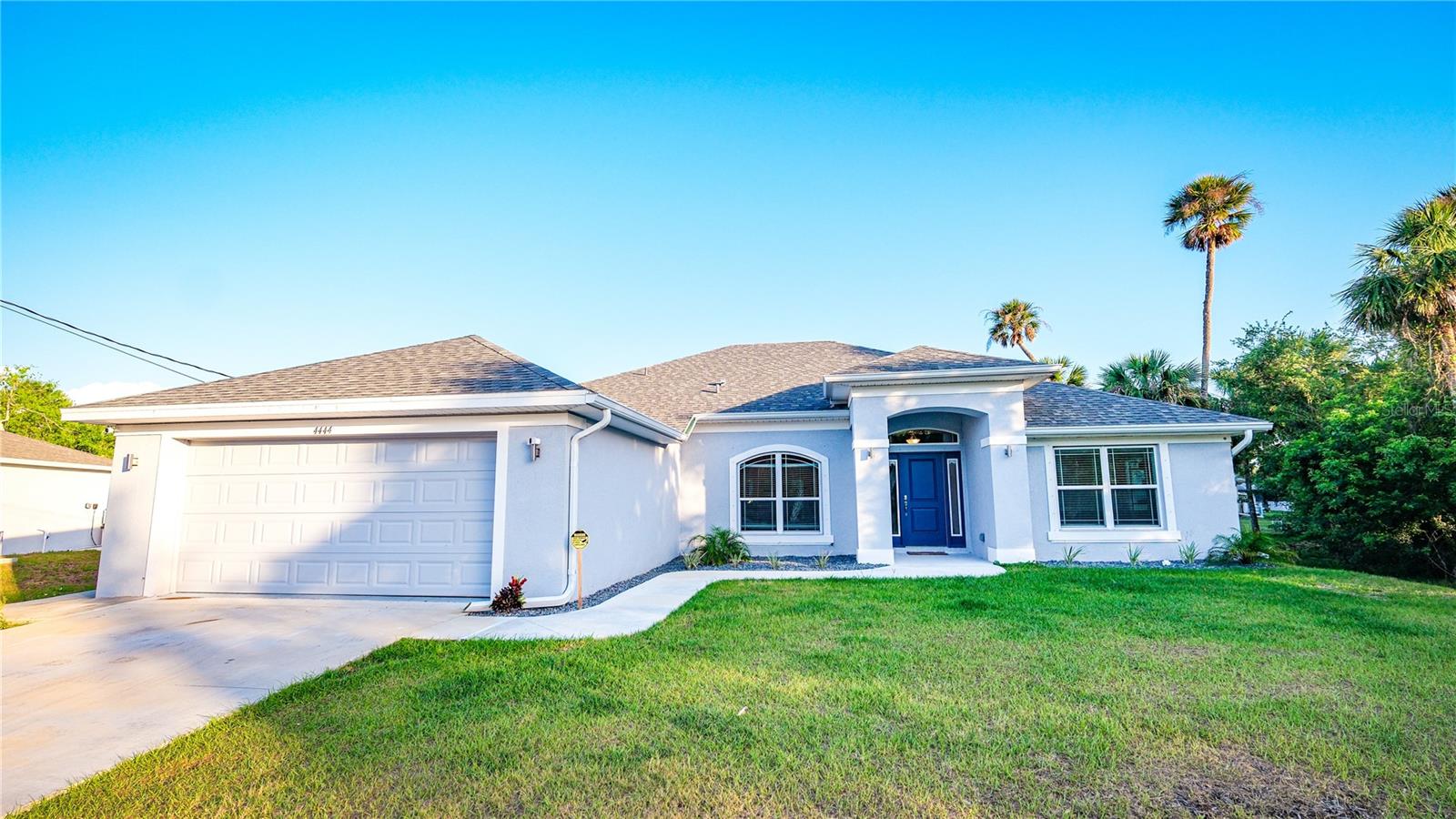 Assumable mortgage rate of 4.99%!! Why buy new construction when all of the extras have been done for you?! This home was brand new in 2023 and lived in for only a year!! Providing everything that the builder didn't include saves you time. Items such as: 2 inch white faux wood blinds, matte finished steel refrigerator, garage door opener, celing fans, durable epoxy garage floor with baseboards, restaurant grade garbage disposal, storage shed, concrete pad for trash cans and upgraded custom landscaping with rocks. This spacious 2265 sqft 4-bedroom, 3-bathroom home features an open floor plan with 10 ft ceilings, creating a light and bright atmosphere. The kitchen has beautiful granite countertops and stainless steel appliances. Additionally there are two bonus rooms to use for office space and hobby rooms. Beautiful whitewashed tile flooring throughout. The primary bedroom features two large walk-in closets and the en suite bathroom includes both a separate tiled shower and a garden tub. Situated on an oversized lot with many palm trees. The property also includes hurricane shutters and rain gutters.