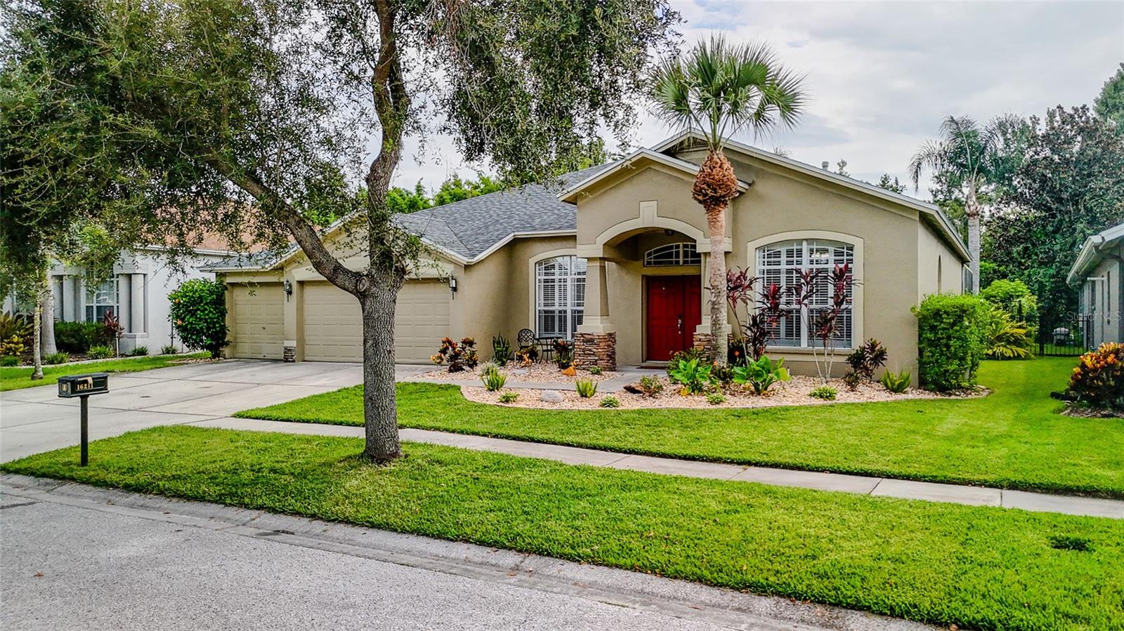 Welcome to your Fishhawk Ranch Dream home! Located on a quiet cul de sac, this property backs up to a conservation area so you will enjoy optimal privacy with no rear neighbors! The home features 5 bedrooms, 3 full bathrooms, a bonus room, 2 living areas, a 3 car garage and a beautiful sparkling pool. Lush Florida landscaping surrounds the home, including banana and papaya trees. The whole house, paid off solar panels will convey to the buyer! This means EXTREME monthly savings on energy bills! Step inside to a bright, open floor plan with soaring ceilings and plenty of room for entertaining. There is wood look tile throughout - one uniform, solid surface floor with modern 5 inch baseboards - making cleaning a breeze. The stunning kitchen is sure to delight the chef of the home with bright cabinets, granite countertops, stainless steel appliances, and a breakfast bar for convenient, quick meals on the go. There is a gas fireplace in the living area off the kitchen that is perfect for chilly evenings. The bedrooms are split for privacy and provide plenty of living space. A luxurious retreat awaits you in the primary bedroom with two walk-in closets, a private slider to the pool, and an ensuite bathroom with a dual sink vanity, large walk-in shower, and a garden tub. In the back you’ll find your own tropical oasis with a beautiful pool, screen in lanai, covered patio area, and two fans to keep you cool! Fishhawk Ranch is a park-like community with loads of wonderful amenities for its residents. There are miles of walking trails, criss-crossing 285-acres of nature preserve, where you can experience plenty of charming wildlife! There is also an amazing aquatic center with resort style pools, fitness centers, tennis courts, rec center, and even a skate park! You’ll have access to top rated schools and also be conveniently close to Fishhawk’s park square that houses various restaurants, shops, and hosts tons of great community activities all year round! Come and check out this home today!