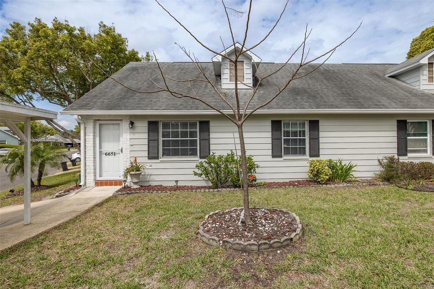 Welcome to this beautifully updated, move-in-ready villa in the highly desirable 55+ community of The Wilds in New Port Richey. Designed for both comfort and style, the open-concept floor plan seamlessly connects the kitchen and spacious living area—perfect for everyday living and effortless entertaining. The primary suite is a true retreat, featuring a large walk-in closet and a stunning, fully remodeled en-suite bath that feels like a spa. A second bedroom, privately situated at the rear of the home, is ideal for guests or a home office and is conveniently located next to a full bathroom. An indoor laundry closet adds to the home’s convenience. This home is packed with upgrades, including brand-new vinyl flooring throughout, a new A/C system, a newer roof, an updated kitchen, fresh exterior paint, and a double parking pad. Step outside to the patio and unwind while enjoying peaceful pond views—your own slice of Florida tranquility. The Wilds is a vibrant, resort-style community once featured on HGTV’s House Hunters, offering a rich lifestyle with amenities that include a heated pool, tennis courts, shuffleboard, and a welcoming clubhouse complete with a pool table, library, fireplace, and full kitchen. Residents enjoy a lively social calendar with activities like game nights, bingo, and community dinners, all set against the backdrop of a serene pond with a fountain. This golf-cart-friendly community (no motorcycles or work trucks permitted) is ideally located just minutes from Downtown New Port Richey’s charming Main Street, where you’ll find restaurants, boutiques, coffee shops, a theater, parks, beaches, medical facilities, and the Aquatic Center. With easy access to Tampa and the Gulf Coast beaches, this home truly offers the best of Florida living. Don’t miss your chance to enjoy an active, friendly lifestyle in one of the area’s most sought-after 55+ communities!