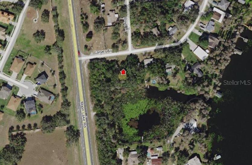 One of the last remaining water front lots. Build your dream home on this large residential site with access to Moon Lake. This area is booming and this lot is close to shopping, dining and other support facilities. Well and septic will be needed.