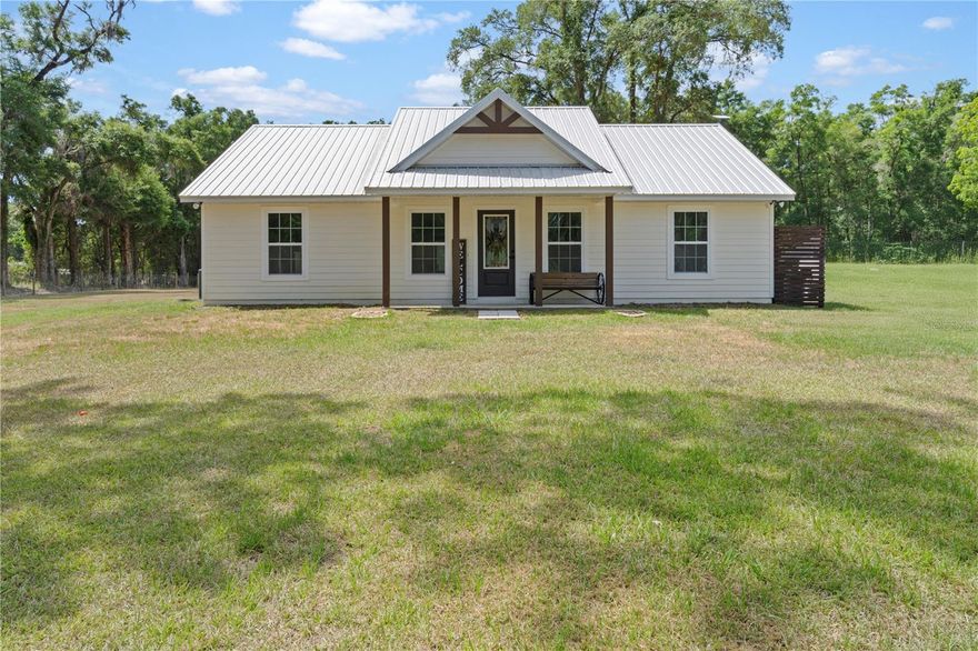 Built in 2022, this 3-bedroom, 2-bathroom home offers a rare opportunity to own newer construction on 1.32 acres situated on a corner lot, providing added space, flexibility, and privacy.

The interior features a clean, modern layout designed for comfortable everyday living, with durable vinyl flooring in the main living areas, carpeted bedrooms, and a functional kitchen complete with soft-close cabinetry and ample workspace.

With 1,156 square feet of living space (1,380 total), the home feels open and efficient while maintaining a comfortable flow throughout.

The property is fully fenced, making it ideal for pets, outdoor use, or entertaining, and includes a 50-amp RV hookup for added convenience and versatility.

Located within close proximity to Devil’s Den Springs, the World Equestrian Center, and HITS, this property also offers a convenient drive to the University of Florida, making it a great option for those seeking space while staying connected to Gainesville’s amenities.

A well balanced property offering newer construction, usable land, and a highly desirable location.