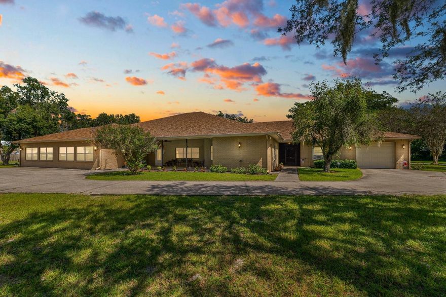 Set on over 13 acres of peaceful countryside, this beautifully remodeled estate offers the perfect blend of luxury, comfort, and functionality. The main residence features six bedrooms and six and a half bathrooms, along with a stunning executive-style kitchen designed for the serious home chef. The kitchen showcases solid wood cabinetry, stone countertops, a spacious island with seating, and butler’s pantry. Outfitted with commercial-grade appliances—all under warranty—it includes a Forno Alta Qualità 48-inch gas range with six burners, a griddle, and double convection ovens, a built-in vented hood with wood-trimmed surround, full-size stainless refrigerator and freezer columns, a Forno Alta Qualità dishwasher, and additional built-in appliances for everyday convenience. The home has been completely updated with new wood tile flooring, a remodeled primary suite featuring an ensuite office, large walk-in closet, and his-and-hers bathroom suite, as well as upgraded doors, baseboards, lighting, and fixtures throughout. Additional updates include a new roof (2023), new barn roof and interior fans (2024), and replaced front gate and operating system. The home is handicap accessible with wide doorways and hallways and features a full security system, commercial-grade fire alarm, and whole-house Generac generator. The property has public water and a private well for irrigation, with all well equipment replaced in 2024, plus two septic systems—both inspected in 2024 and confirmed in proper working condition. A covered breezeway connects the main home to a detached guest or mother-in-law suite with its own entrance, one bedroom, one bathroom, office, full kitchen, and living area—ideal for guests or rental income. Outdoor features include multiple screened porches, a four-stall horse stable, shed/workshop, attached one-car garage with extra storage, and a detached 50’ x 25’ garage that can accommodate up to six vehicles. The property also includes a private gated entrance and offers the flexibility to subdivide. This exceptional property combines refined design, modern upgrades, and wide-open acreage to deliver the very best of luxurious country living.