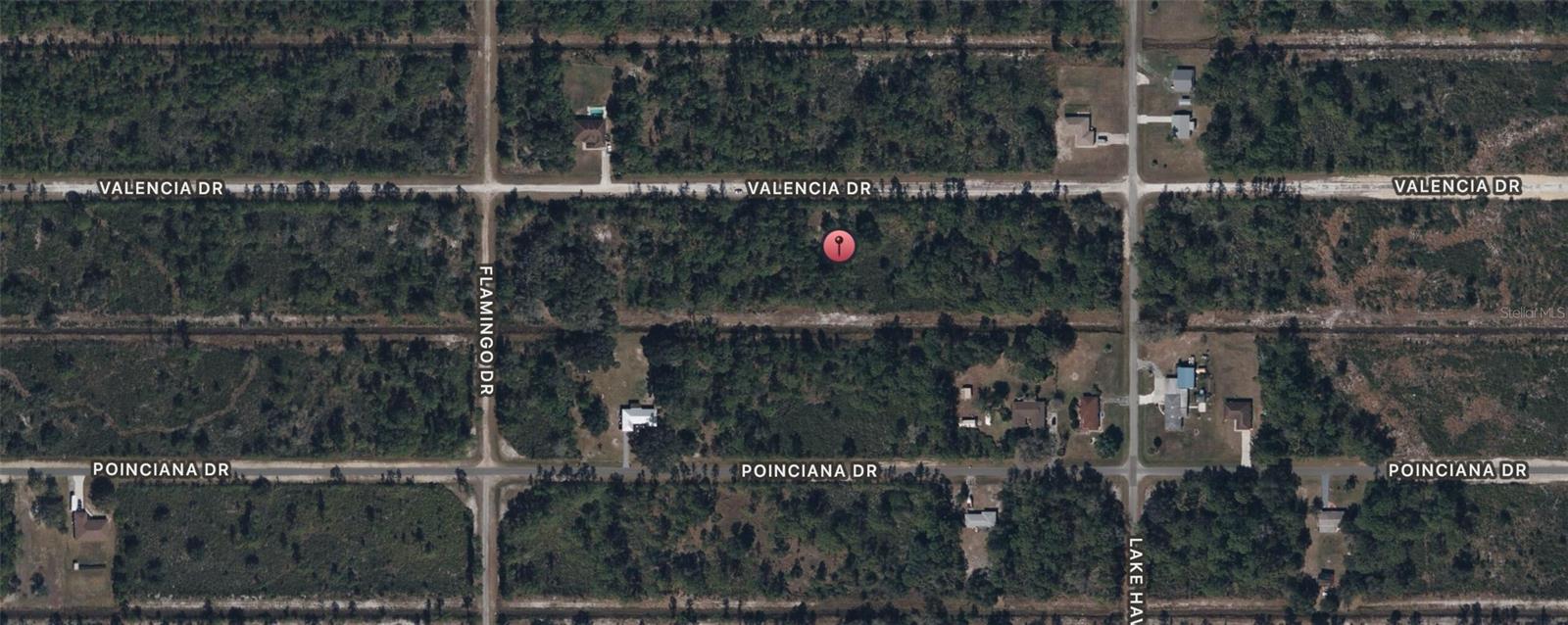 Build Your Dream Home on Valencia Drive in Indi Lake Estates, a premier gated community in the heart of Central Florida! This half-acre lot has a serene, nature-filled environment surrounded by exceptional amenities and breathtaking landscapes.
Community Highlights:
• Lake Weohyakapka, known as “Lake Walk In Water:” Enjoy some of Florida’s best bass fishing on this 7,500-acre lake, complete with the state’s longest freshwater pier, a marina, and a boat ramp.
• Golf