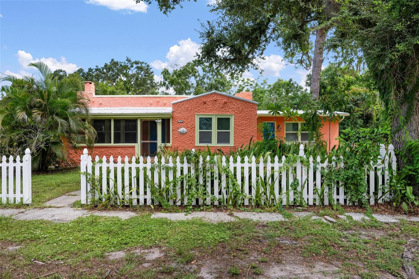 THIS IS A RARE FIND! GORGEOUS 4 BEDROOM 2 BATHROOM HISTORIC 1925 SPANISH STYLE HOME! You will love all the charm that this home has to offer. The living room features a wood burning fireplace, large windows that let in tons of natural light and built-in bookshelves. The kitchen comes with beautiful freshly painted blue cabinets and plenty of space to cook for your friends and family. The 4 bedrooms offer plenty of space and also feature large windows to let in the sun light. Both bathrooms are updated and the first one features a bathtub/ shower combo, and the second one is a walk-in shower. All of this is located on an oversized lot. It is the perfect place for your kids to play or park your RV or boats.