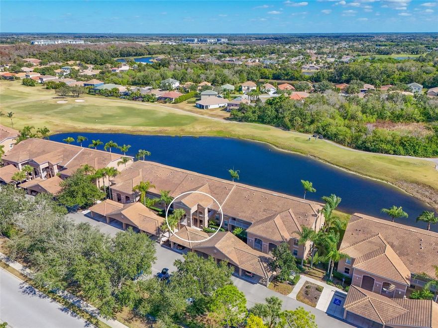 Enjoy breathtaking views the moment you walk through the door with sweeping lake and golf views visible throughout the home. This two-bedroom, two-bath condominium is perfect for full-time living or a seasonal retreat, offering comfort, convenience, and effortless Florida living. This desirable ground-floor location is just steps from your covered parking space, making everyday living easy and accessible. The fully equipped kitchen features Corian countertops, SS appliances, Cabinets with crown moulding, a breakfast bar, 2 closet pantry's, and a charming eat-in nook. A formal dining area flows seamlessly into the great room, creating an open and inviting floor plan ideal for both relaxing and entertaining.  Sliding glass doors from the great room lead to a screened, covered lanai where you can unwind and take in the peaceful views. The primary suite offers an oversized layout with a small sitting area by the window, architectural niches, large vanity in the en-suite bath, and a generous walk-in closet. Tile flooring runs throughout the main living areas, and the laundry closet includes a washer and dryer that convey with the unit. 2nd bedroom and 2nd bath complete this desirable split floorplan.  Stoneybrook at Heritage Harbour offers an impressive array of included amenities. Enjoy a community pool conveniently across the street, pickleball & tennis courts, fitness center, sand volleyball, basketball, scenic bike paths, dog park, and a Jr. Olympic-size pool and spa at the community Rec center. Residents also enjoy a calendar of social events and activities.  Public golf course so no mandatory fees.  Many options for the casual golfer or just enjoy the restaurant and grill at the clubhouse.  Ideally located near Costco, medical facilities, restaurants, and UTC mall.  Stoneybrook is also just a short drive to downtown Sarasota and the gorgeous beaches of Anna Maria Island, Siesta Key, and St. Pete. HOA fees include exterior maintenance, exterior insurance, Roofs, pest control, basic cable, water, sewer, and trash, offering exceptional value and making this an excellent low-maintenance, lock-and-leave home for seasonal residents or an easy full-time lifestyle for year-round buyers.