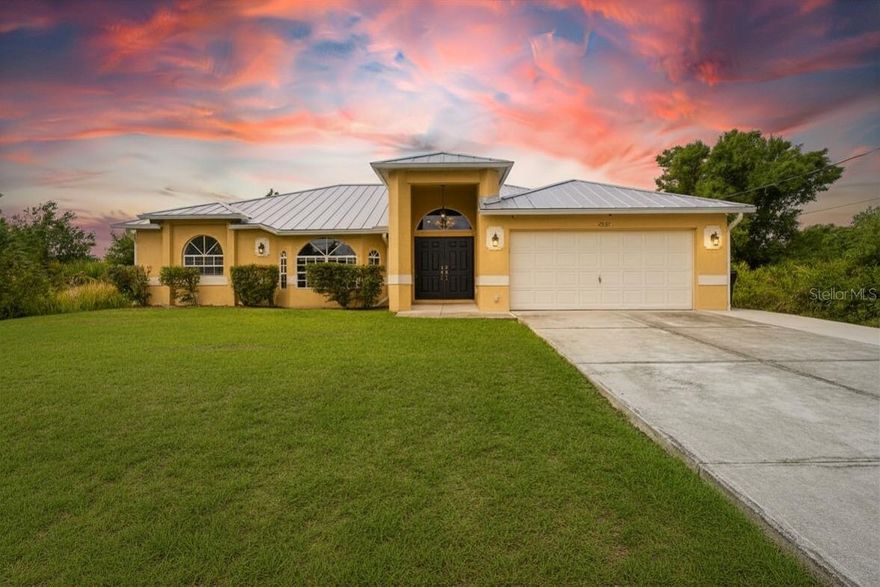 Major updates make this North Port home an exceptional value, featuring a newer metal roof and a brand-new water heater. The property is equipped with solar panels and a salt-free water softener system for added efficiency and convenience. Inside, you’ll find an updated kitchen with all-new appliances, new granite countertops, and luxury vinyl plank flooring in select areas, complemented by tile flooring in other rooms. Situated in Flood Zone X, no flood insurance is required. For added peace of mind, the home includes a 24-hour security system with a 16-camera high-definition surveillance setup.

Welcome to this beautifully updated 3-bedroom, 2-bath split floor plan home, designed for both comfort and everyday living. With the primary suite thoughtfully positioned on its own side of the home, you’ll enjoy added privacy, along with a spacious walk-in closet and an en suite bathroom featuring dual sinks, a relaxing garden tub and a separate walk-in shower.

The heart of the home is the open kitchen and living area, perfect for gathering and entertaining. The kitchen features all-new appliances, granite countertops, and a convenient breakfast bar. A dining area just off the kitchen flows seamlessly into the living room, creating an open and inviting space ideal for everyday living and hosting guests.

Step outside and take full advantage of Florida living. The oversized backyard offers plenty of room for pets, play, or creating your own outdoor retreat. The expansive lanai is a true highlight, enclosed with sliding glass doors on three sides, plus a pass-through window to the kitchen—ideal for entertaining or simply enjoying the breeze year-round. Additional features include a dedicated laundry room with a sink and washer/dryer hookups.

Conveniently situated near shopping, dining, and medical facilities, this home is just minutes from the new Sarasota Memorial Hospital campus currently being built. You’ll also appreciate being close to Cocoplum Village Shops, offering easy access to grocery stores, fitness centers, retail shopping, banking, and a variety of casual and sit-down dining options. Enjoy nearby attractions such as the North Port Aquatic Center, North Port City Green, and the growing Wellen Park area, home to the Atlanta Braves Spring Training stadium, along with local shops, restaurants, and community events. This home is a short drive to the Gulf beaches, with easy access to I-75 and US-41, makes commuting throughout Southwest Florida simple and convenient.

This home offers the perfect blend of privacy, space, and accessibility—ideal for relaxing, entertaining, and enjoying the Florida lifestyle.
