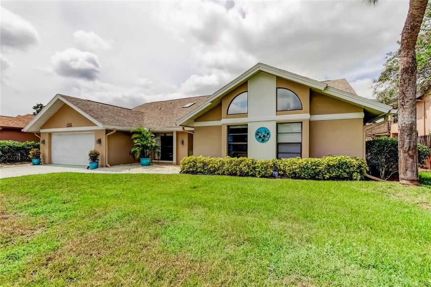 Welcome to this beautifully maintained 4 bedroom, 2.5 bath home with an office/nursery in the highly desirable golf cart friendly community of Huntington Trails.  One of the larger homes in the neighborhood, it features a flexible split-bedroom layout with expansive, light-filled living areas and thoughtful updates throughout. The spacious great room with soaring ceilings, skylights and large wood burning fireplace flows seamlessly into the dining area and built-in bar with wine refrigerator, creating the ultimate setting for entertaining. The updated kitchen is designed for both style and function, offering sleek cabinetry, quartz countertops, gas stove, and two pantries. An adjoining eat-in space opens through French doors to the screened patio and includes additional cabinets and countertop space—perfect for a coffee bar or serving station. Three independent AC systems (2 installed in 2025, the 3rd one in 2020) provide year-round efficiency and comfort. All bathrooms have been beautifully updated. The primary suite easily accommodates large furnishings and boasts a walk-in closet with custom built-ins, along with a spa-like en suite bath featuring double sinks, jetted tub, and walk-in shower. A flexible office/nursery is located off the primary suite, providing privacy and convenience. The oversized third bedroom with walk-in closet and adjoining bath with a large walk-in shower makes an ideal teen or in-law suite. A versatile bonus room off the great room can serve as a library, media lounge, or playroom.  Outdoor living shines with both a screened patio and an open-air patio for dining or relaxation. The yard is low-maintenance and fully fenced on three sides, offering both privacy and peace of mind. Additional features include a tankless water heater, water softener, hurricane garage door and newer roof (2018) for peace of mind.  Just minutes from Main Street Safety Harbor, you can walk, bike, or ride your golf cart to shops, restaurants, waterfront parks, and lively festivals. Marshall Street Park—with trails, tennis, pickleball, and a playground—is a short walk away, while Tampa International Airport, Clearwater Beach, and Honeymoon Island are all easily accessible