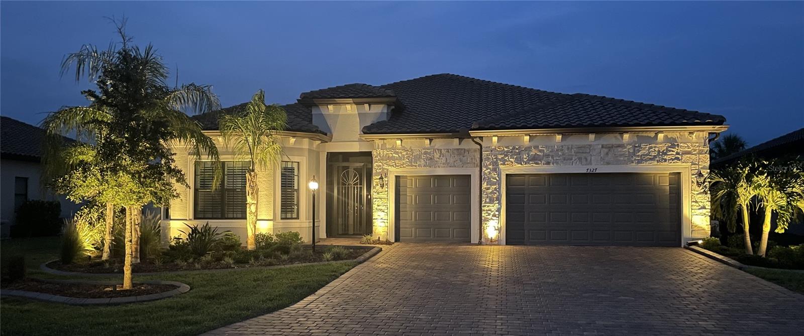 This exceptional Renown model was originally built for a fellow new home industry professional, showcasing an impressive array of thoughtfully curated, luxury upgrades. Featuring 3 bedrooms—all with en-suite baths—plus a powder room and a separate lanai half bath, this home redefines turnkey living.
The original build included over $265,000 in Pulte structural and design enhancements, followed by an additional $293,000 in aftermarket upgrades—bringing the total investment to over $550,000 in premium improvements. Every detail has been meticulously curated, from custom closets, upgraded electrical and structural features, a whole-home generator, and motorized hurricane screens, to extensive trim work including wood-cased openings and two-stage crown molding throughout.
The gourmet kitchen is outfitted with a KitchenAid premium appliance suite and finished with premium finishes and materials that blend style with performance. Even the oversized three-car garage impresses, featuring two refrigerators, a freezer, and customized storage—so well-equipped, you could practically live in it.
A full list of upgrades and improvements is attached—this is a home that truly lives up to its promise of excellence.
Located in the heart of Lakewood Ranch, Del Webb is a premier 55+ gated community offering an unparalleled resort-style lifestyle. Residents enjoy access to a 28,000 sq. ft. clubhouse, on-site restaurant and bar, full-time lifestyle director, fitness center, heated resort and lap pools, tennis, pickleball, bocce ball, and miles of scenic trails. All this, just minutes from dining, shopping, golf, and the powdery sand of the Gulf Coast.