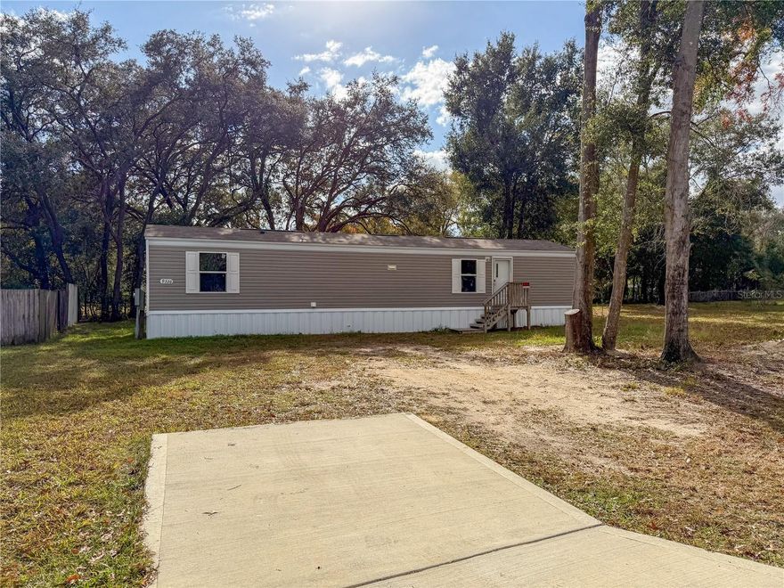 Affordable Florida Living - Priced to Sell! Newer 2023 single wide conveniently located in Summerfield just off of 441 - an easy drive to The Villages, Belleview or Ocala! Located on a paved road with new septic and underground power connection when installed in 2023. Inside, you will appreciate the open floor plan with vinyl plank flooring throughout, spacious kitchen with range, refrigerator and dishwasher plus adjacent laundry room. The split bedroom floor plan features one bedroom with built-in closet and adjacent bathroom with shower/tub combo and an additional bedroom on the opposite side of the home. The backyard features a newer storage shed. Schedule your private tour before this one is gone!
