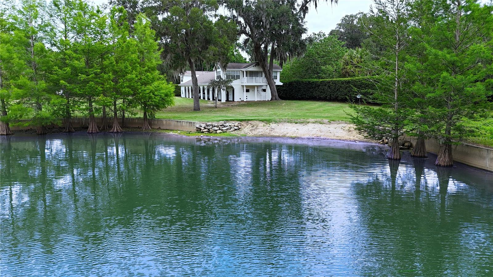 Impressive 24+/- Acre Equestrian Retreat with Spacious Living and More!
The main home boasts 3 bedrooms and 3 baths, along with an office and a bonus room above the garage, providing ample space for work and relaxation. Additionally, there's a spacious 4-car garage, perfect for storing vehicles and equipment. The kitchen is open to the family room, creating a seamless, entertaining flow. Enjoy serene living with an idyllic stocked pond, ideal for quiet afternoons or family fishing.
Designed for the equestrian lifestyle. It features an 11-stall barn, complete with two charming upstairs apartments. The apartment offers the potential to expand or modify the number of bedrooms, making it perfect for families, employees, or guests. 3 connecting buildings, one of which is enclosed for equipment storage. The second building is partially enclosed with A/C, perfect for a gym, storage, or a covered outdoor entertaining area. The third building is covered but not enclosed, so you can use it as you choose.
Whether you’re riding, relaxing, or entertaining, this versatile property has it all, making it perfect for horse lovers. With plenty of open space and picturesque scenery, there’s room for all your equestrian sports and outdoor activities.
Ideally located near the prestigious Country Club of Ocala, the Florida Horse Park, and the Santos Trailhead, perfect for outdoor enthusiasts! Don’t miss out on this incredible opportunity to create your dream oasis in a beautiful, serene setting; acquiring additional acreage is also an option. Schedule your private tour today and envision the endless possibilities!