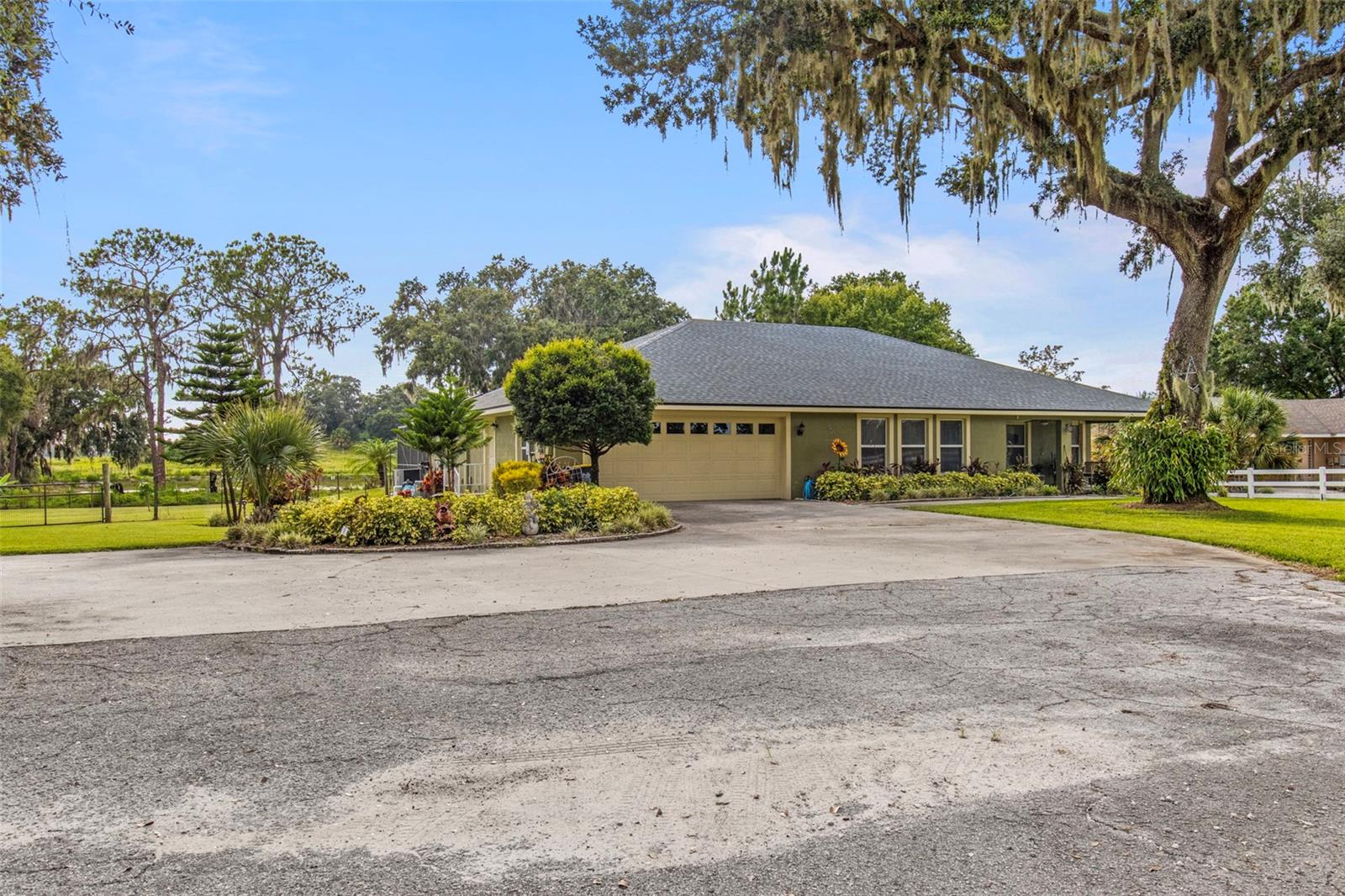 Welcome to 70 Arthur Lane — a rare opportunity in Winter Haven offering privacy, space, and multi-use flexibility on 3.5 fully fenced acres with no HOA. The main home features 3 bedrooms, 2.5 bathrooms, over 2,400 sq ft of living space, and a screened-in saltwater pool with hot tub, all overlooking a wooded lake for ultimate tranquility. Major updates include a 2023 roof, two AC units from 2024, and fully paid-off solar panels, significantly reducing your monthly electric bill. The spacious, open layout is ideal for entertaining. Just steps away, a detached 900 sq ft guest apartment offers 2 bedrooms, 1 bathroom, a full kitchen, its own 2024 metal roof, and a private entrance — perfect for guests, in-laws, or rental income. The gated property also includes a chicken coop, green space, and plenty of room to roam or bring animals. Peaceful and secluded yet close to town, this property is the perfect retreat for those craving space, comfort, and versatility.