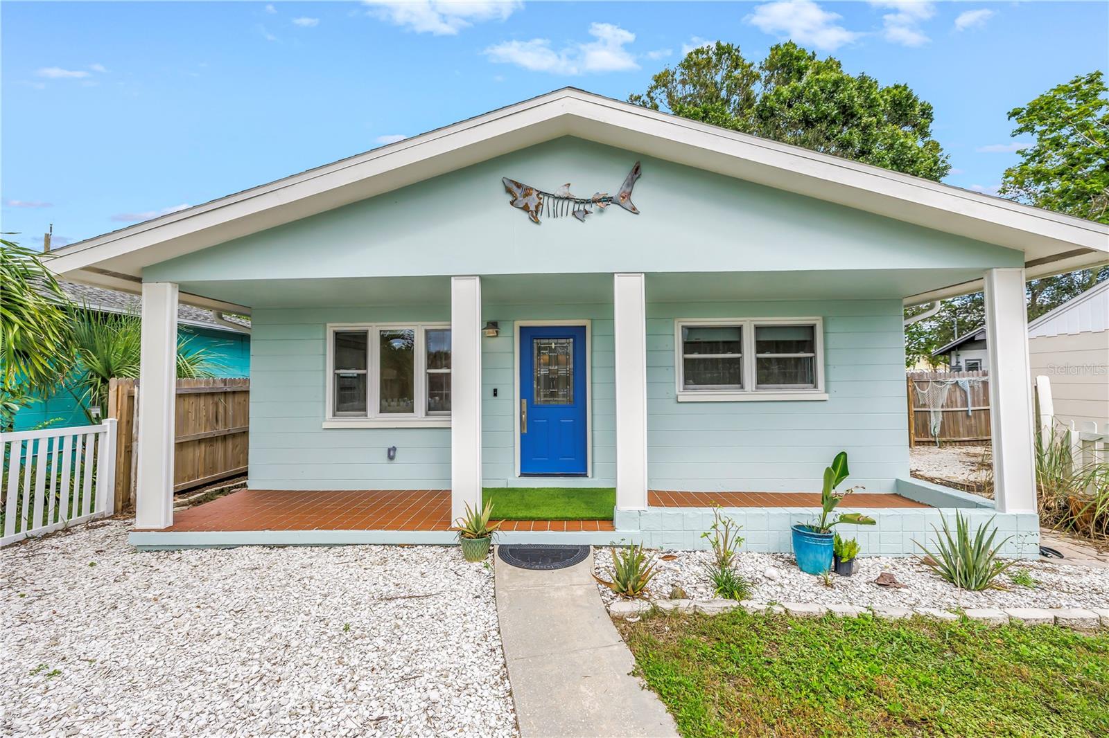 One or more photo(s) has been virtually staged. Just three blocks from the heart of Gulfport, this fully remodeled 3-bedroom, 2-bathroom block home puts you right in the middle of one of the most vibrant communities in Florida. Gulfport is known for its artistic, waterfront charm with lively festivals, art shows, a marina, and an incredible selection of local restaurants. It is the perfect location to enjoy it all! Inside, the home features an open and light-filled floor plan with a custom kitchen showcasing Londos cabinetry, quartz countertops, new Kitchen-Aid Gallery appliances, updated windows, and coastal finishes throughout. Updates include new bathrooms, doors, lighting, hot water heater, and the patio/carport roof was replaced in 2023. There are three spacious bedrooms, with the middle room also serving perfectly as a den or home office. Step outside to an expansive covered patio ideal for entertaining or relaxing Florida-style evenings. The exterior offers a laundry room, storage shed, tropical landscaping, and a charming picket fence that completes the coastal vibe. This move-in-ready Gulfport gem is the perfect opportunity to enjoy the best of Florida living in an exciting community!