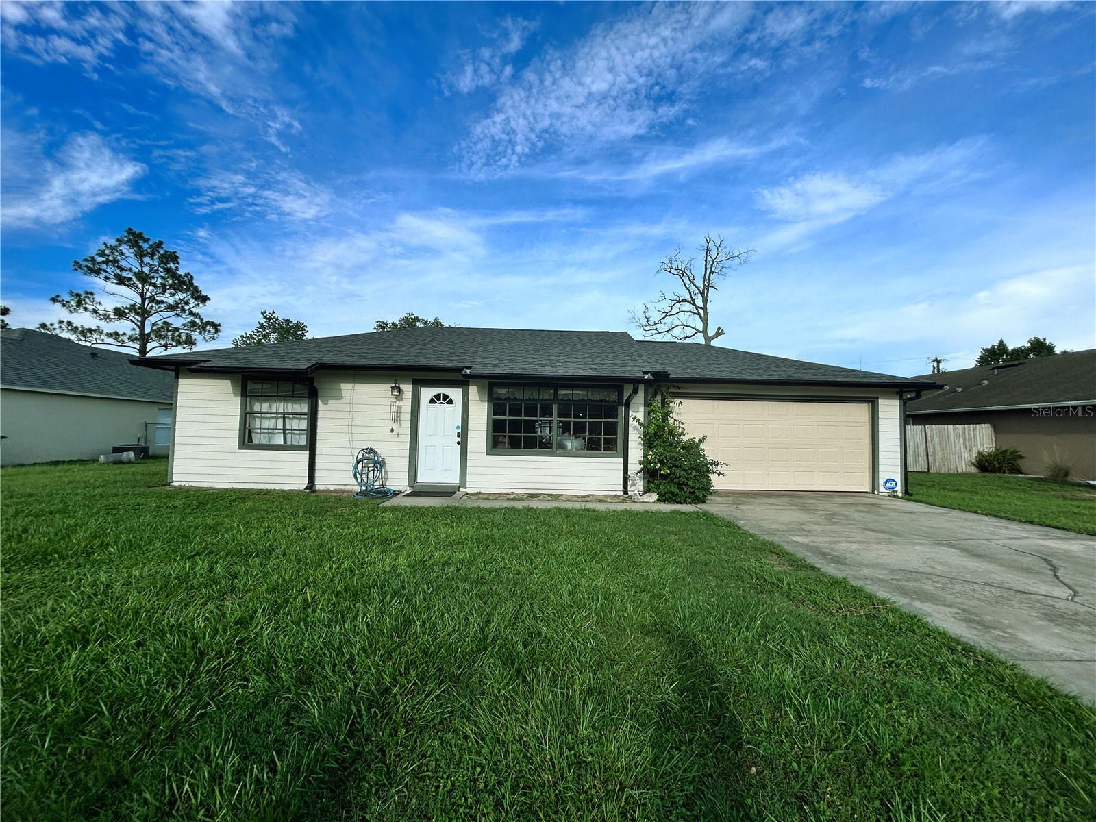 Charming 2-Bedroom, Home with Oversized Lot & 2-Car Garage!
Welcome to 1665 Brewton Circle, a well-maintained 2 bedroom, 1 bathroom home nestled in the heart of Deltona. Situated on a spacious lot, this home offers privacy, room to roam, and a rare oversized two-car garage—perfect for vehicles, storage, or a workshop setup.
Inside, you’ll find a functional layout with tile flooring throughout the main living areas and wood-look vinyl plank flooring in both bedrooms. The light and bright kitchen features modern gray cabinetry, faux granite countertops, a closet pantry, and a full suite of appliances. A cozy dining area leads to sliding glass doors that open to a concrete patio, ideal for outdoor dining, grilling, or relaxing with your morning coffee.
Whether you're a first-time buyer, downsizing, or looking for a solid investment property, this home offers great value and potential. Conveniently located near schools, parks, shopping, and I-4 for easy commuting.