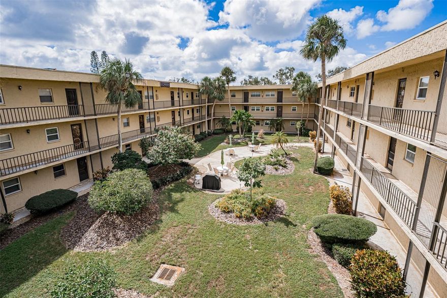 LOCATION!!! Corner condo in a vibrant 55+ community with endless amenities. Both bedrooms feature Hurricane Impact Windows, and the primary bedroom boasts a walk-in closet and ensuite bath. Enjoy your morning beverage or evenings on the screened in balcony.  The layout is a split plan which is great privacy for family or guests.  The community offers a HEATED pool with SPA, and each floor has a convenient laundry room. The clubhouse includes exercise equipment, a library, a pool table, ping pong table, card table, a cozy living room with a large-screen TV, a piano for music lovers, and shuffleboard. Stroll down to the large waterfront gazebo to relax, fish, read, or enjoy the wildlife or maybe you will go down to the courtyard and have a cookout with your neighbors. Unit has it's own storage closet and also a separate community storage for bikes. Just minutes to our beautiful Beaches. Close to restaurants, shopping, and boutiques, this is the lifestyle you’ve been dreaming of. Furniture can be included for convenience.  Don’t wait—make your move today!
