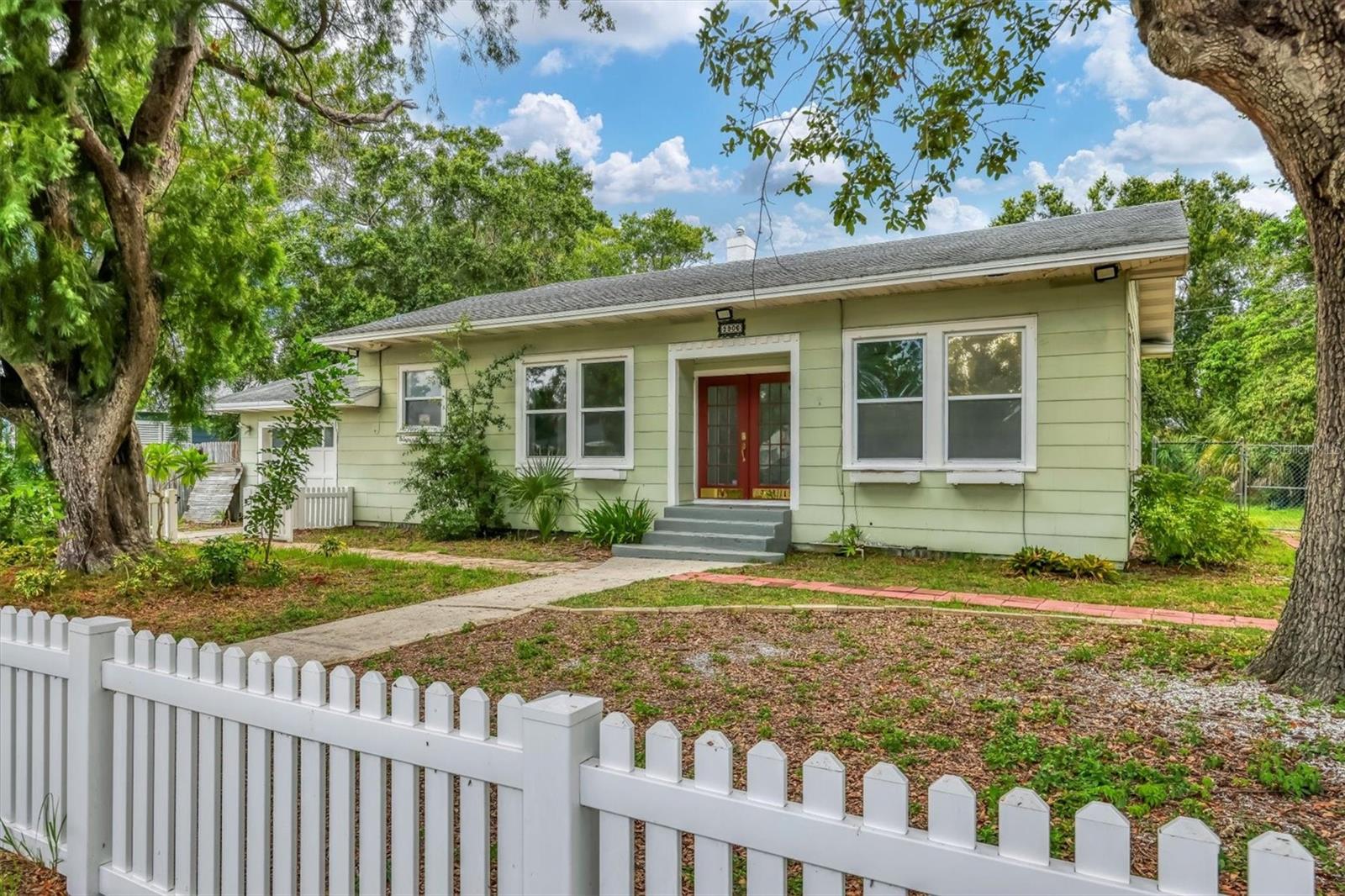 Step into a piece of Old Florida with this beautifully preserved 1925-built home, brimming with character and charm. Located on a spacious corner lot in desirable West Bradenton, this 3-bedroom, 2-bathroom residence offers over 1,900 square feet of inviting living space.
You’ll fall in love with the recently refinished hardwood floors, freshly painted original plaster walls, and soaring 9.5-foot ceilings that evoke a classic elegance throughout. Modern updates blend seamlessly with vintage appeal, including new appliances and a thoughtfully converted garage—now serving as a versatile utility room with extra space ideal for a home office or workshop.
The expansive lot provides ample room to add a pool, guest house, or lush garden oasis. Just minutes from SRQ Airport and the stunning beaches of Anna Maria Island, this location offers the best of both convenience and coastal living. Enjoy easy access to top-rated schools, shopping, dining, recreation, and entertainment.
Don’t miss your chance to own a unique slice of Florida history—where timeless design meets everyday comfort.