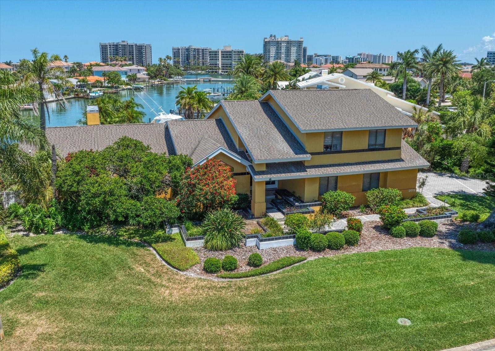 The locale is picture postcard perfect. An oversized and unheard of quarter of an acre lot within Belleair Beach’s Northern Geography just 2 streets off of the Sand Key Corridor wholly walkable to the beach access. Remarkable to the cause is the water feature- THE FRONT OVERLOOKS AN ELONGATED STRETCH OF CANAL ALONG BELLE ISLE, AND THE BACK OFFERS PROTECTED BOATING ACCESSING CLEARWATER’S HARBOR, AND THE GULF OF MEXICO. The home itself is incredibly stylish, modish and exquisite in its custom approach when it was originally built in the late 70’s, but is now looking forward to a complete refresh. An enviable floor plan projects a 2 story great room playfully cantilevered over the seaside pool and dock in the sanctuary like back yard- an adjacent city owned green public easement ensures for privacy, and a tranquil aesthetic. 4 BEDROOMS, 3 FULL BATHS WITH THE PRIMARY SUITE DOWNSTAIRS ENCOMPASS 3,100 SQUARE FEET OF EXCEPTIONAL LIVING SPACE ON TWO LEVELS. THERE HAVE BEEN SIGNIFICANT STRUCTURAL IMPROVEMENTS TO THE PROPERTY: NEWER ROOF, A/C’s and POOL RESURFACE. THERE WAS NO STORM DAMAGE SHY OF LOSING SOME LANDSCAPING. 14 FOOT ELEVATION. MARKET RELEVANT PRICED.