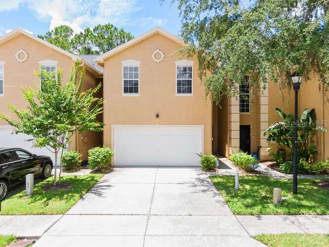 Welcome to this beautiful townhome rental located in the gated community of Emerald Pointe, nestled in desirable Tampa Palms. Step inside to soaring ceilings, abundant natural light, and a neutral color palette that complements the open floorplan. The tiled foyer leads to warm wood laminate flooring throughout the main living areas. The inviting kitchen features stainless steel appliances and a breakfast bar that overlooks the dining area and family room — perfect for everyday living and entertaining. A convenient powder room is also located on the first floor. Upstairs, you’ll find two spacious bedrooms, each with its own private en-suite bathroom. The home also includes an attached two-car garage with a washer and dryer provided. Enjoy peaceful conservation views from the screened and covered lanai, situated on a quiet cul-de-sac for added privacy. Ideally located near top-rated schools, shopping, dining, the YMCA, and all that New Tampa and Tampa Palms have to offer. Convenient access to I-75, USF, and Moffitt Cancer Center. Note: Tenant must carry a renter’s insurance policy including liability coverage.