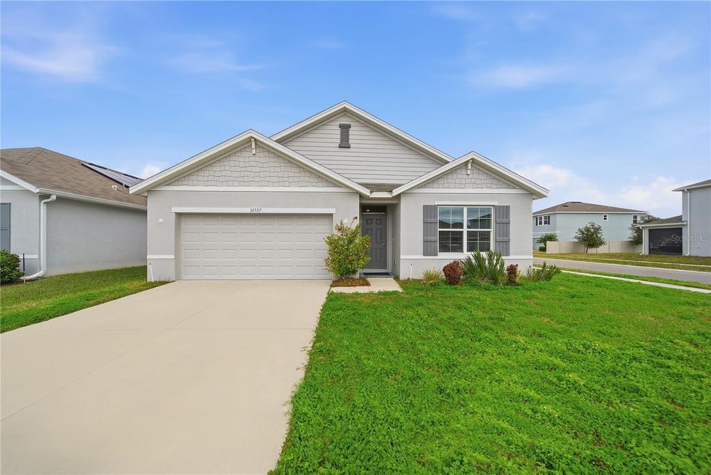 Photo of 32597 Kobuk Valley Avenue, Wesley Chapel, FL 33543 (MLS # TB8467241)