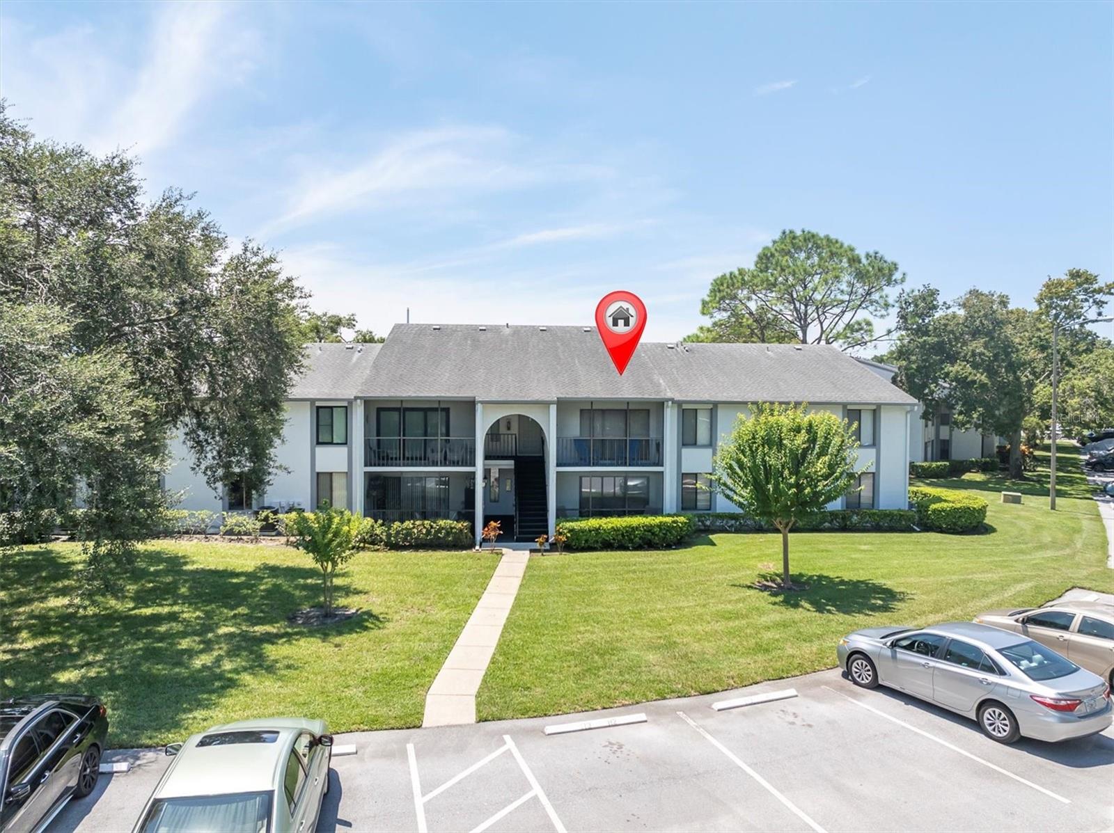 Located in the heart of the East Lake Corridor with Brooker Creek Preserve to the east and Lake Tarpon to the west Pine Ridge Village I, a resort style community and a true lifestyle. Surrounded by nature yet close proximity to schools, shops, restaurants, library, grocery and more. This rare second floor unit offers 3bedrooms and 2 full bathrooms, with a walk in closet and ensuite in the primary bedroom. Enjoy relaxing on the screen enclosed patio. New A/C in 2017, Large inside Laundry room complete with washer/dryer, new luxury vinyl flooring throughout with tile in the bathrooms and carpet in the bedrooms. The kitchen is updated with stainless steal appliances and an abundance of wood cabinetry, it also offers a breakfast nook. There is a separate dining room and living room. The third bedroom has double doors and can be used as an office. Enjoy outdoor living on the screened enclosed patio off of the living room. Pine Ridge at Lake Tarpon Village One is the ideal place to make your next home. Large heated pool and spa on a scenic lake with tennis courts, walking paths and a recreation building/clubhouse. Quarterly maintenance fee includes lawn care, water, basic cable, sewer & trash. Well maintained community with lots of ponds, conservation and walking trails. Move in ready unit is available for immediate occupancy!