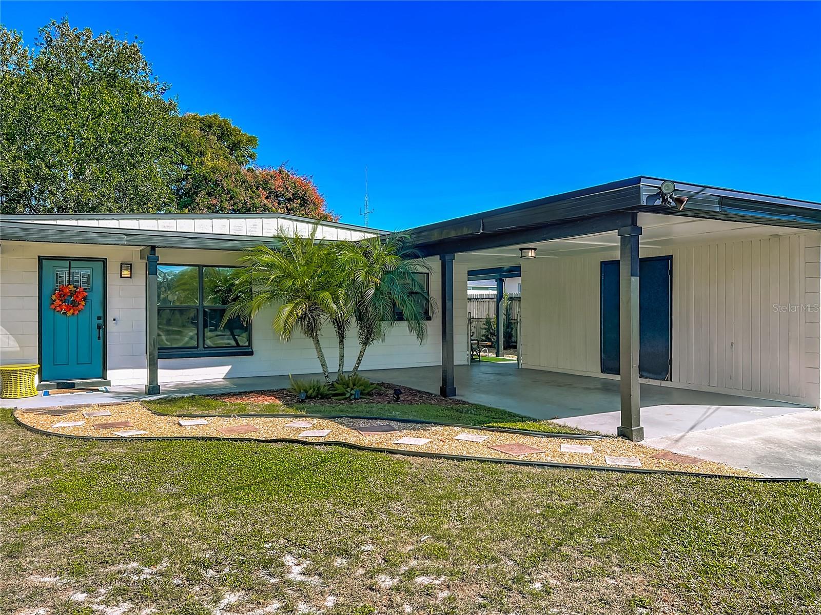 Welcome to 1913 Larkin Ave- a beautifully updated 3Bd/2Ba home quietly situated on a dead end street with-in the Valencia Park neighborhood. This nicely maintained home offers an inviting feel with its spacious, well designed layout and soaring ceilings. Large windows fill the foyer and living room with natural sunlight, creating a warm and comfortable atmosphere. The kitchen is large with an eat in dining area with added storage and plenty of cabinets with a bar area as well for quick snacks or full sit down meals. The primary bedroom has its own en-suite full bathroom and walk in closet, which is a rare find for this mid century ranch home. Enjoy the extra storage and detached laundry room, a carport, and a large Fenced Backyard with a covered seating area perfect for pets, BBQ's and a quiet shaded space for play or to unwind. offering peace and privacy while still just minutes from downtown Orlando (3 miles), Orlando International Airport (MCO) (6 miles) major highways(408) and shopping walking distance away. Zoned for top-rated schools- Boone High School and with NO HOA, this Gem is ideal for Families or Investors! Recent upgrades include a NEW ROOF (2021), UPDATED PLUMBING (2021), Freshly painted inside and out (2023) Newer Stainless-Steel Appliances, Granite counter tops (2021) Septic Serviced (2022). Must See to appreciate this relaxing and easy to maintain home