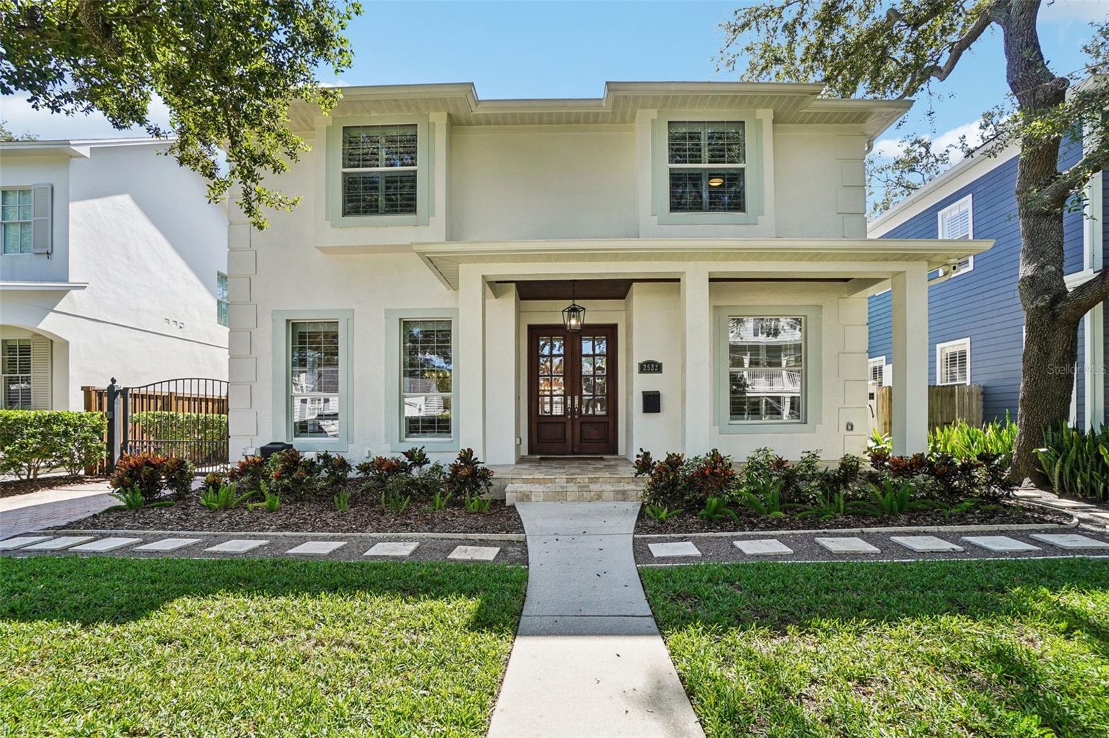 Welcome to this lovely POOL home in New Suburb Beautiful, one of the most coveted neighborhoods in all of South Tampa, known for picturesque tree lined streets, top schools, convenient location, and a HIGH AND DRY elevation giving you stress free living where no flood insurance is required. From the welcoming front porch you will step through the front door onto brand new wide plank white oak flooring installed throughout the entire home. As you enter the home the living area and dining room are on your left. Towards the back of the home is the beautifully updated kitchen with a Thermador 6 burner gas range, all stainless-steel appliances, a microwave drawer, a wine fridge, and an eat-in kitchen nook. The kitchen is open to the expansive family room with gas fireplace and French doors leading to the screened in lanai all overlooking the heated pool with light colored travertine pavers. The detached 2 car garage is accessed through the privately GATED driveway with front and rear doors for easy and convenient drive through ally access. The first floor also features a bedroom which would make a perfect guest suite/den/office along with a full bath. Upstairs are 4 more spacious bedrooms, a guest bathroom, laundry, and the owner’s suite with a vaulted ceiling, walk-in-closet, a timeless black and white tiled bathroom with double sinks, a jacuzzi tub and a separate walk-in shower. You must see this perfectly maintained home in this gorgeous neighborhood!