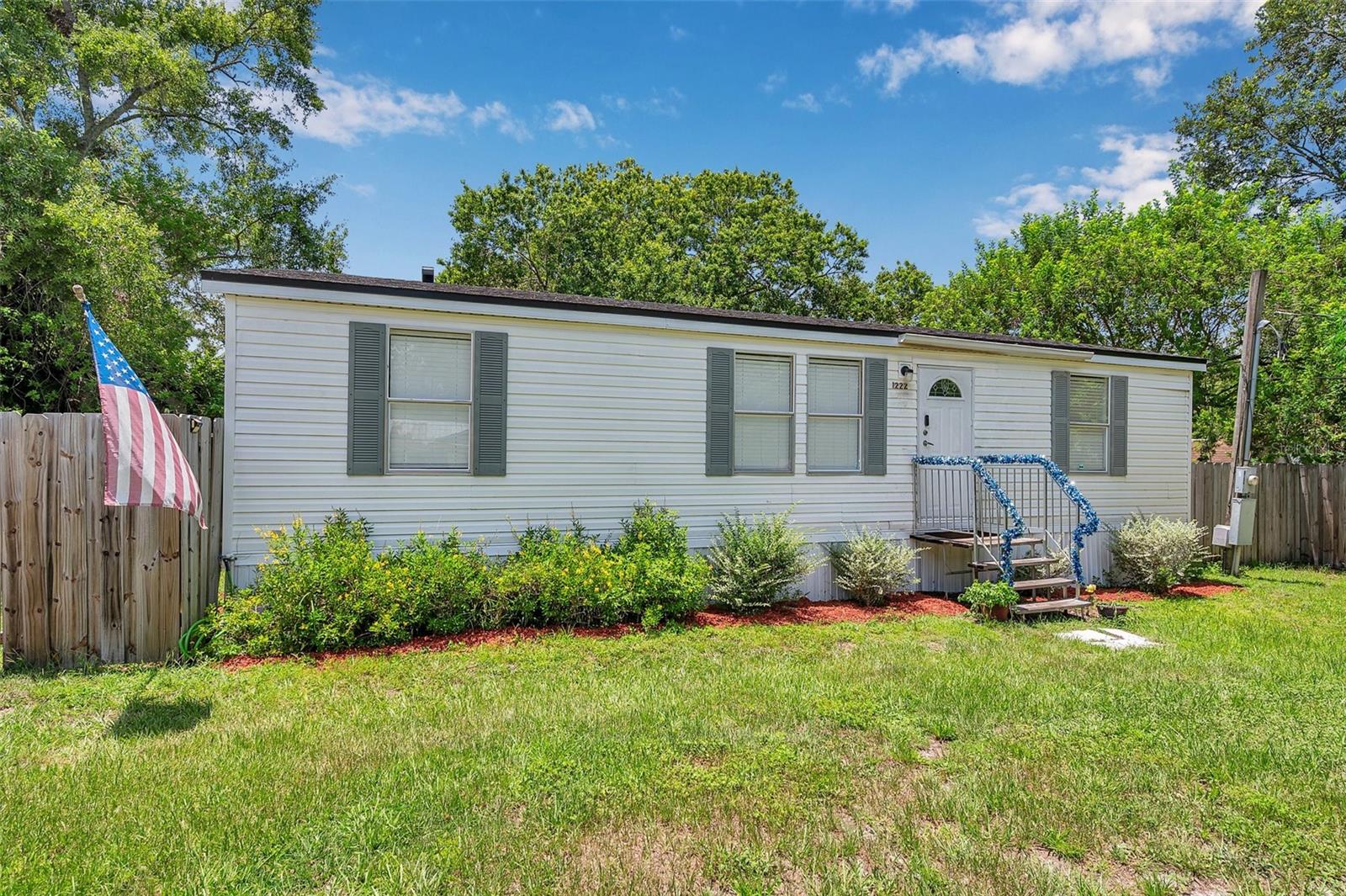 One or more photo(s) has been virtually staged. AS IS and No Concessions, cash only! Motivated Sellers! Come see this well-maintained 3-bedroom, 2-bathroom manufactured home in a peaceful, county-like setting in Auburndale, FL. Conveniently located near Highway 92 with quick access to both Lakeland and Winter Haven, this property offers the perfect blend of space, comfort, and freedom—with no HOA and no lot rent. The open split floor plan features vinyl flooring throughout, and comes complete with all appliances, a water filtration system, and a recently serviced septic system (cleaned just 6 months ago). The roof, privacy fencing, and storage shed are all less than 5 years old, and the A/C was installed in 2019, giving you peace of mind for years to come.
Sitting on a spacious lot, there’s plenty of room to park your RV, boat, trailer, and multiple vehicles. Whether you’re looking for your first home, a place to downsize, or just want a little more space without all the restrictions, this property checks all the boxes. The sellers are motivated and ready to move on to their dream destination—don’t miss your chance to make this home yours before it’s gone! (some areas of the floor dip)