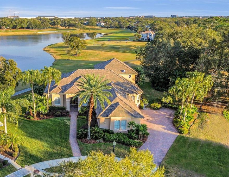 Experience the ultimate Heathrow vista from this remarkable Hillcrest custom home, boasting a replaced tile roof(2017), NEW AC(2023), NEW WATER HEATER(2023), NEW KARASTAN LUXURY FLOORS(2023), NEW QUARTZ KITCHEN COUNTERTOPS(2023), FULLY REMODELED MASTER BATH(2023) and much more - $200K in recent upgrades!! Nestled on a serene cul-de-sac, this property spans nearly half an acre, boasting unrivaled water and golf panoramas. The residence is encircled by greenery, affording a unique sense of privacy. Upon entering through bespoke double doors, the open layout reveals breathtaking scenery at every turn. With its soaring ceilings, the luminous floor plan creates an airy ambiance. The kitchen, resembling a culinary haven worthy of a Michelin star, showcases an expansive island featuring a vegetable sink and ample storage. Custom cabinetry with specialized pull-outs, a BRAND NEW(Sept. 2023) 48” Built in GE Cafe Refrigerator in Stainless Steel, Bosch dishwasher, Thermador double ovens, and a gas range enhance the space along with brand new quartz countertops. With its brand new Karastan flooring, the master suite on the lower level offers dual walk-in closets, while an additional downstairs bedroom functions as a comfortable guest suite with an en-suite bathroom and spacious walk-in closet. Unwind in the rear yard paved with brick pavers, overlooking breathtaking water and golf views. The covered lanai, equipped with electric screens, provides an ideal retreat. Upstairs, two bedrooms with mesmerizing views, a full bath, and a versatile loft area await. The generous three-car garage includes built-in storage, while a brand new central home vacuum(installed 2023) ensures ease of care for the home. Heathrow, a well-established and incredible 24-hour guarded community, is conveniently situated near premier attractions, dining, shopping, and major thoroughfares. Residents enjoy various amenities, such as Sawyer Lake Park, a clubhouse, soccer fields, and basketball courts. Access to the golf course, racquet club, and swimming pool is available with club membership.  This property may be under audio/visual surveillance.