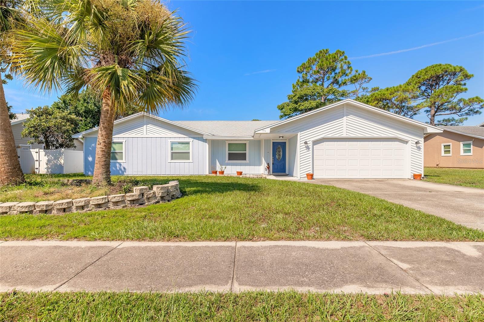 Welcome to your beautifully remodeled pool home in the heart of Port Orange! Located in the highly sought-after Countryside subdivision, with no HOA fees, this stunning 3-bedroom, 2-bathroom residence offers the perfect blend of modern upgrades and an ideal location within an A+ rated school zone. Step inside to discover an open floor plan and porcelain tile flooring throughout, offering both durability and easy maintenance. The stylish kitchen is a true showstopper, featuring stainless steel appliances, granite countertops, a farmhouse sink, custom tiled backsplash, and a built-in breakfast bar perfect for casual dining. The kitchen flows seamlessly into the cozy sitting room, where a gas-burning fireplace adds warmth and charm. The spacious living room and adjacent dining area provide plenty of room for entertaining. The primary bedroom features an en suite bathroom and a walk-in closet, while the guest bedrooms are generously sized, offering comfort and flexibility for family or visitors. New hurricane-impact sliding doors in both the dining room and primary bedroom lead out to your private outdoor oasis. The screen-enclosed pool deck is ideal for year-round enjoyment, and the fully fenced backyard offers both privacy and a secure space for pets or play. Whether you’re looking for a full-time residence or a short-term rental opportunity, this home is a rare find in one of the most desirable neighborhoods in Port Orange. Roof 2023, hot water heater 2023 and AC 2016. Don’t miss your chance to own this move-in ready gem! All information deemed accurate but cannot be guaranteed.