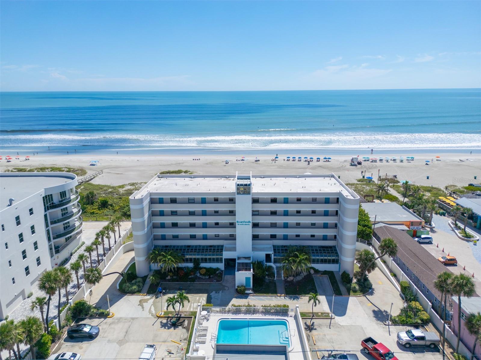 DIRECT OCEANFRONT vacation rental opportunity awaits! Completely RENOVATED and FULLY FURNISHED, this turn-key retreat offers excellent income potential with WEEKLY RENTALS allowed. The stylish kitchen boasts granite countertops, stainless steel appliances, and a breakfast bar that flows into the open living and dining area. Sliding glass doors from both the living room and primary suite lead to a private balcony, perfect for enjoying sunrises over the water. Beautiful tile plank flooring runs throughout for a clean, modern look. Spend your days with private beach access just steps away, then unwind at the sparkling community pool. The secure lobby and under-building assigned parking provide ease and peace of mind. Located in the heart of downtown Cocoa Beach, you are within walking distance to popular restaurants, shops, and entertainment, making this the ultimate coastal getaway or income-producing investment. Call for your private showing today!