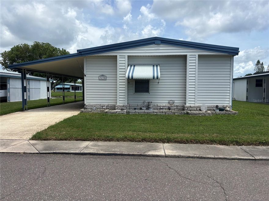 Discover your own slice of sunshine in Tanglewood Mobile Village, a friendly 55+ lakefront community just minutes from Tarpon Springs, three Gulf beaches, and all the best of coastal Florida living.
This 2-bed, 2-bath double-wide sits directly on the water with tranquil lake views — the perfect blank canvas for your winter retreat. The home is ready for a full remodel, letting you design your dream getaway exactly how you want it: airy coastal cottage, modern minimalist, or vintage Florida charm.
Low monthly fees of just $143 cover community amenities including a heated pool, shuffleboard courts, and a clubhouse with a commercial kitchen and social calendar full of seasonal activities. Bring your golf cart, your small dog, and your imagination — this peaceful, non-flood-zone location makes year-round or part-time living a breeze.
Whether you’re a snowbird seeking a project with personality or an investor looking for a low-maintenance flip in a thriving 55+ neighborhood, this is your opportunity to create something special by the lake.  Lawn Maintenance included too!