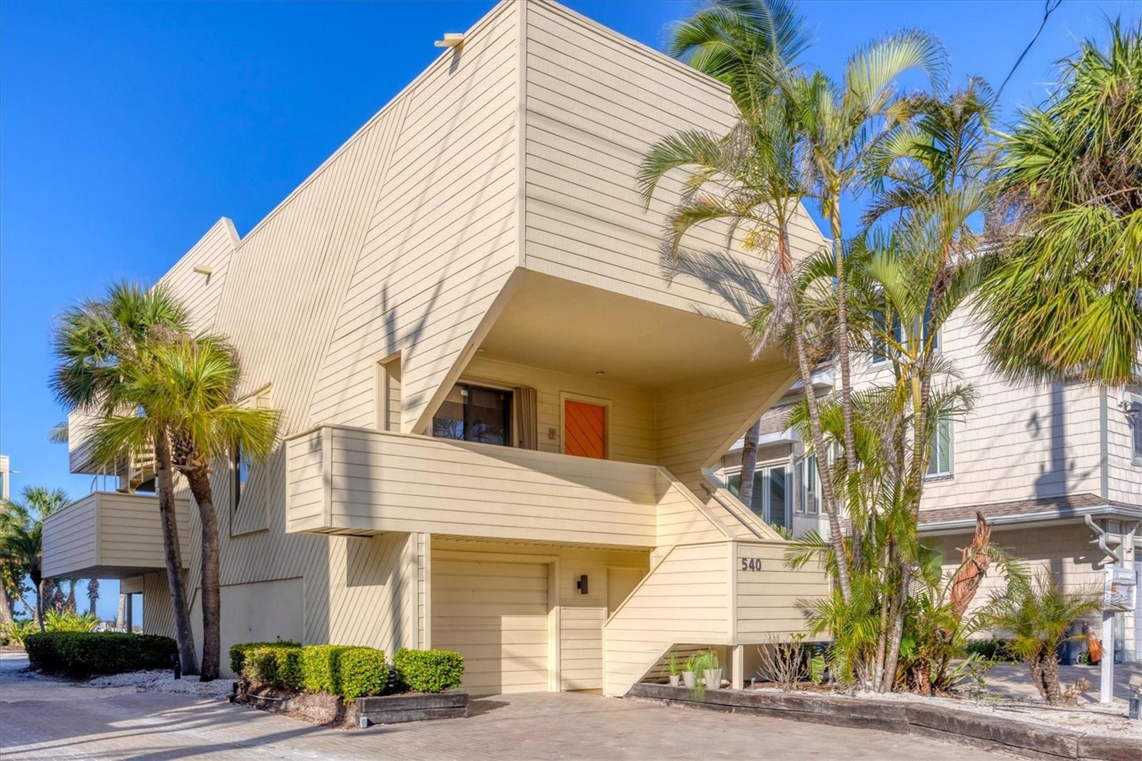 A beachfront home for the price of a condo. 540 Beach Road on Siesta Key is a three-story standalone Gulf front residence with private beach access and breathtaking views directly on famed Siesta Key Beach. Privacy and exclusivity await at Tiffany Sands, an enclave of only 9 units. With expansive Gulf views from the moment you open the front door, 540 Beach Road is a detached single-family condo overlooking the sandy shores of the #1 beach in America.
This meticulously maintained 2 bedroom, 3 ½ bath home features a bonus cabana room and one-car attached garage. With pride of ownership and nearly 1,900 sq ft under air, this maintenance-free standalone villa features private beach access. Every floor boasts floor-to-ceiling sliding glass doors and expansive terraces with stunning unobstructed views of the shimmering shores of the Gulf. With just over 3,000 sq ft total combined living space, the light-filled, open-plan main level consists of a recently remodeled kitchen, half bath, living room and dining area. 16’ newly installed sliding glass doors provide access to the main covered deck, a great spot for your morning coffee and perfect for entertaining or relaxing as you revel at the majestic views of the beach and stunning sunsets. On the upper floor you will find 2 large en-suite bedrooms with private, newly updated full baths. The main suite has spectacular views with floor-to-ceiling sliding glass doors that open to a private deck, the perfect spot for sunning or reading a book. Main suite has 3 large closets and an oversized bathroom with double vanities and skylights. The 2nd bedroom features a cozy deck with sliders and a private bath with skylight. On the upper floor you will find a large laundry closet with new washer & dryer. The downstairs cabana room is complete with full bath and storage, floor-to-ceiling sliders and a covered patio with direct access to the beach. 540 Beach comes with private parking for 5 cars and additional guest parking.
540 Beach is situated precisely one-half mile to the heart of Siesta Key Village and a half mile to world renowned Siesta Key Public Beach.
You have the option to make this your forever home or a lucrative vacation rental, as the present owners enjoy months of using the residence for their personal pleasure and rent it for a portion of the year, garnering substantial rental income. Home is equipped with 2 A/C units- one of which is BRAND NEW, new sliders on the upper levels, new hot water heater and storm shutters. 15+ years remain on the roof warranty. A one-of-a-kind property, 540 Beach is a private beachfront residence that feels like a home but is priced like a condo. Available turnkey furnished.