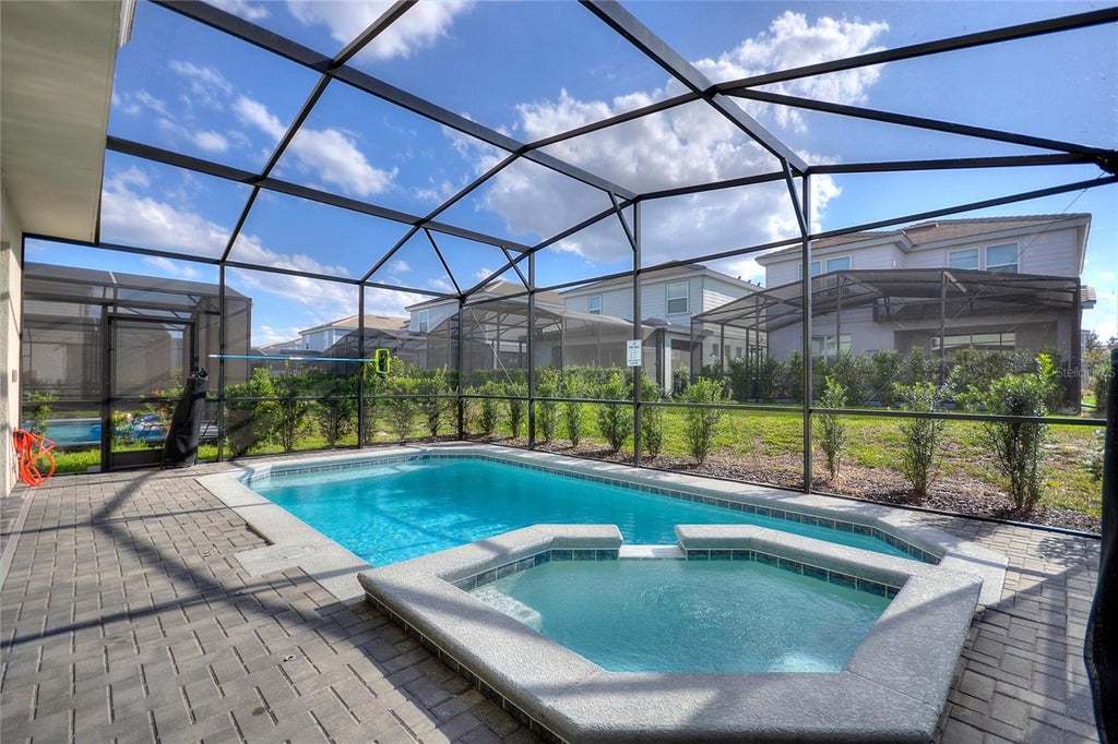 Photo of 7240 Oakmoss Loop, Davenport, FL 33837 (MLS # O6450546)