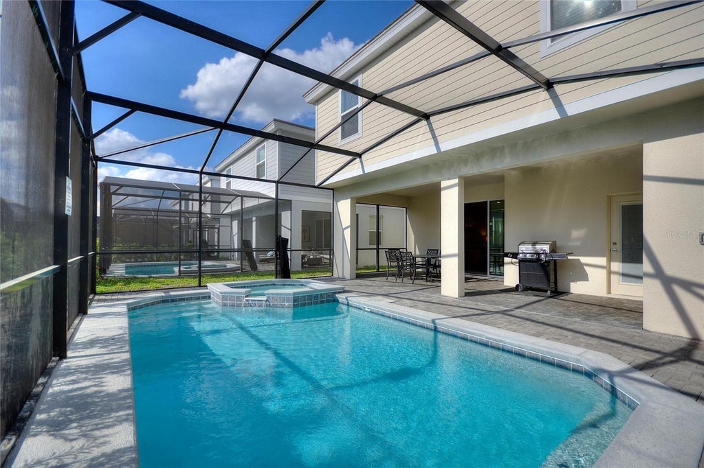 Photo of 7240 Oakmoss Loop, Davenport, FL 33837 (MLS # O6450546)