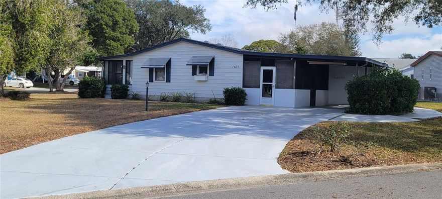 Welcome home to this charming 940 sq. ft., 2-bedroom, 1-bath residence perfectly situated on a desirable corner lot in The Villages Historic District. Offering just the right amount of space for comfortable everyday living and effortless entertaining, this home combines low-maintenance convenience with affordability. Inside, you’ll appreciate the well-designed layout with seamless flow from room to room, creating a bright and inviting atmosphere. The spacious enclosed front porch features a wet bar area—perfect for relaxing with your morning coffee or hosting friends and neighbors. Additional highlights include a golf cart garage with a dedicated laundry area and large storage closet, covered parking, an oversized driveway, and an outdoor grilling patio ideal for enjoying Florida’s beautiful weather year-round. While the home could benefit from a little TLC, it presents a wonderful opportunity to add your personal touch and build instant equity in a prime location. Ideally located near Spanish Springs Town Square, this home offers easy access to golf courses, shopping, dining, recreational activities, and nearby medical offices throughout The Villages. This delightful corner-lot property offers added privacy, charm, and exceptional value—making it a fantastic opportunity to enjoy the vibrant lifestyle The Villages is known for.  Make this beautiful home yours today!