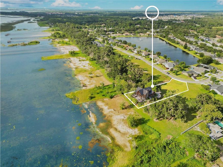 Bring your vision to life on this beautiful vacant waterfront  lot in one of St. Cloud’s sought-after GATED communities. Just shy of an acre, this property offers the perfect opportunity to build your dream home  ! Enjoy peaceful water views, your own private dock, and breathtaking sunsets right from your future backyard. Whether you’re looking to build a full-time residence, second home  or a relaxing retreat, this rare lakefront lot offers the space, scenery, and lifestyle you’ve been searching for Discover the opportunity to build your dream waterfront estate on nearly .8 acres along the shores of East Lake Toho inside one of Osceola County’s most sought-after gated communities.

Unlike newer subdivisions near Lake Nona, this rare homesite offers something increasingly difficult to find — meaningful acreage, direct waterfront access, mature natural surroundings, and lasting privacy.

Positioned to capture breathtaking western-facing sunset views, the property overlooks East Lake Toho with evening reflections stretching across the water, creating the perfect backdrop for future outdoor living and architectural design. A mature oak hammock anchors the rear of the property, offering a natural privacy buffer and an established setting that cleared lots simply cannot replicate.

The recent value repositioning creates an exceptional advantage for the next owner, allowing additional flexibility to immediately incorporate luxury features into the build such as a private dock, resort-style pool, summer kitchen, expansive outdoor entertaining space, or custom lakefront design elements from the very beginning.

Despite the peaceful waterfront setting, the location remains highly connected — just minutes from Lake Nona Medical City, premier dining, shopping, major highways, and Orlando International Airport.

As buildable waterfront inventory near Lake Nona continues to disappear, opportunities like this become increasingly rare. This is more than vacant land — it is the foundation for a lifestyle that cannot easily be replicated.

More land. More water. More privacy. A smarter entry point into luxury waterfront living.

Schedule your private tour today to experience the scale, setting, and sunset views in person.