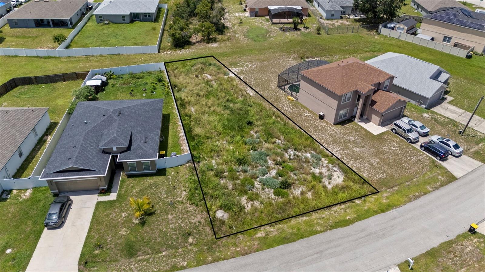 The seller owns 12 lots in Poinciana, several on the same street, which can be PURCHASED IN BULK, presenting a rare opportunity for builders or investors to secure multiple parcels at once at a discounted rate. MLS Numbers: O6335500, O6335683, O6335685, O6335689, O6335698, O6335703, O6335716, O6335719, O6335719, O6335730, O6335755. With no large trees, this lot at 1914 Escambia Ln is ready for your next project. The low HOA fee includes access to the Poinciana Victory Pool, Aquatic Center with 8 lap lanes, and the APV Community Center featuring event rooms, an amphitheater, a fitness center, and expansive outdoor recreation with sports fields, basketball courts, playgrounds, picnic areas, and walking trails. High-speed internet (300 Mbps) and cable TV (250+ channels) are also included. The lot is conveniently located near shopping centers and restaurants. It’s a short drive to Disney, SeaWorld, Universal Studios, Legoland, and Orlando International Airport, offering both lifestyle and convenience. This lot is perfect for new construction or long-term investment. With low HOA fees, abundant amenities, and strong area growth, these Poinciana lots provide unmatched opportunity for builders, investors, or future homeowners.