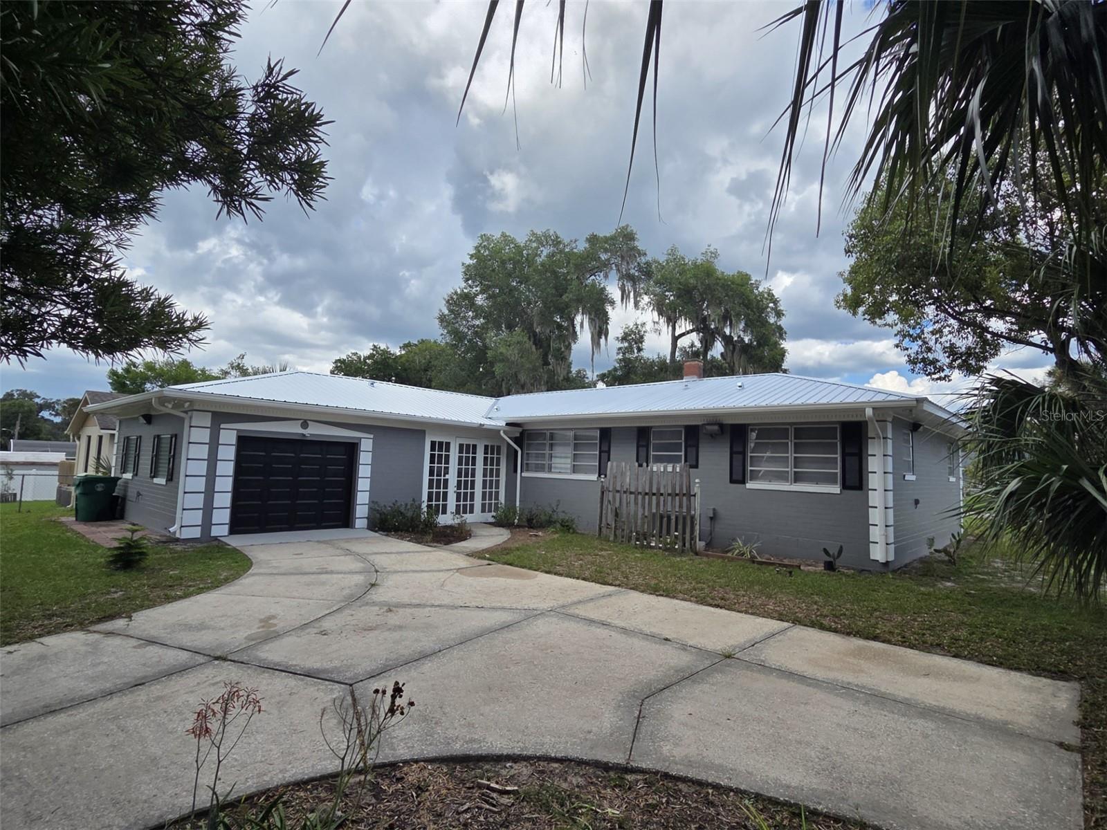 BRAND NEW METAL ROOF! Welcome to this charming 2-bedroom, 1-bathroom residence featuring a delightful bonus Florida room and a warm, welcoming ambiance. Nestled in a highly sought-after location, this home offers the perfect blend of convenience and tranquility, making it an ideal place to settle in and create lasting memories.
Step inside and you’re greeted by new LVP floors that flow seamlessly throughout the main living areas, adding natural elegance and classic appeal. Expansive windows fill the interior with abundant natural light, creating a bright, airy, and uplifting atmosphere. The heart of the home is the spacious living room—perfect for relaxing with loved ones or hosting intimate gatherings. The kitchen, brimming with nostalgic charm, features original appliances and cabinetry, along with ample counter and storage space to meet all your culinary needs.
Adjacent to the kitchen and dining area lies the versatile Florida room—a serene retreat that can serve as a cozy reading nook, inspiring art studio, or the perfect spot to sip your morning coffee while enjoying peaceful backyard views. Two generously sized bedrooms share a well-appointed full bathroom, while a breezeway off the Florida room leads to the garage and backyard, providing extra storage space for seasonal décor, outdoor gear, or hobbies.
Beyond the home’s inviting interiors, you’ll appreciate its prime location—just moments from an array of restaurants offering diverse dining experiences and minutes from award-winning Downtown, where shopping, entertainment, and community events abound. This is more than a home—it’s a lifestyle, offering comfort, character, and proximity to everything you love.