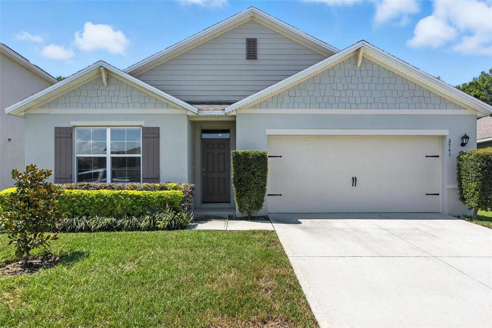 Charming, move-in-ready 4BR/2BA home in the heart of Mount Dora! This spacious, light-filled property features an open-concept floor plan with a modern kitchen equipped with stainless steel appliances, quartz-style countertops, white cabinetry, and a large island. Freshly painted in 2024, the interior is crisp and clean with tile flooring throughout the main living areas. Enjoy the oversized 12x40 screened-in lanai—perfect for entertaining or relaxing while overlooking the private, fenced backyard with wooded views and no rear neighbors.
The primary suite offers peaceful comfort, while three additional bedrooms provide versatility for guests, office space, or family. Designer lighting, arched hallways, and neutral tones give this home a stylish and welcoming feel.
Located in a quiet community with two playgrounds & a community pool just minutes from downtown Mount Dora and convenient to Orlando attractions, shopping, and dining. Low-maintenance yard, 2-car garage, and easy access to major highways make this home the perfect blend of comfort and convenience.
Don’t miss this opportunity—schedule your private showing today!