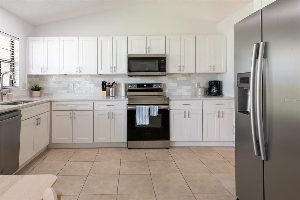 Photo of 1085 Indian Ridge Trl E, Kissimmee, FL 34747 (MLS # O6446053)