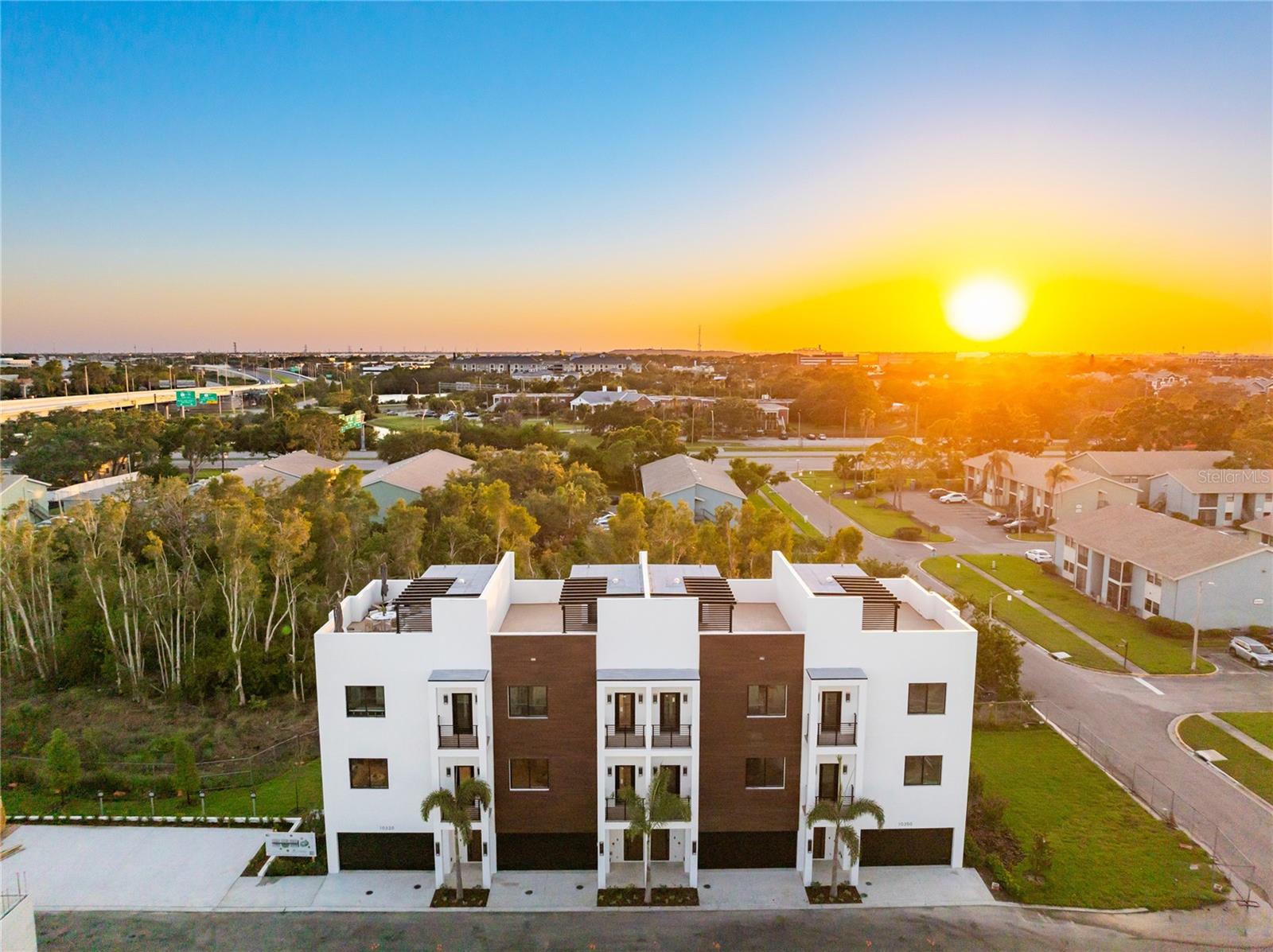 Baypoint Luxury Townhomes modern, brand-new residences offering private rooftop living in one of the most central locations in the Tampa Bay area. Each townhome includes its own private rooftop terrace an outdoor living space like no other complete with a personal hot tub, built-in grill, sink, custom pergola, LED lighting, and Bluetooth speakers. It's the perfect extension of your home for entertaining or unwinding in style.
These 4-story homes feature nearly 1,800 sq. ft. of thoughtfully designed space with 3 bedrooms, 2.5 bathrooms, and a rare 4-car garage with EV charging. All block construction, impact-rated windows and doors, and elevated living keeps each home high and dry while providing peace of mind year-round.
Inside, you'll find open-concept living, high ceilings, Samsung Bespoke appliances, Calacatta Quartz countertops, and premium finishes throughout. The layout and design prioritize comfort, functionality, and effortless modern living.
Baypoint is ideally located near Downtown St. Petersburg, Downtown Tampa, and the region's best Gulf beaches offering unbeatable access to work, dining, entertainment, and the water.
Now available. Schedule your private tour today availability is limited.