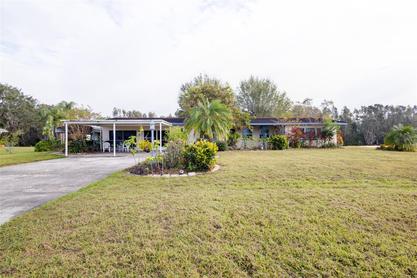 Don't miss this amazing opportunity! Located in Indian Lake Estates, a golf and lake community in Central Florida, this home provides two bedrooms/one bath in the main house and a full bathroom in the garage. This charming home is nestled on a 1/2 acre canal frontage lot that feeds into Lake Walk In Water. The floor plan provides for two nice-size bedrooms, a large living room that has sliders that open out to an all season/Florida room. Lots of living area to gather and entertain friends and family! The dining area is located just off the kitchen that also has an informal eating area. The garage is oversized and also provides lots of storage area. There is plenty of covered parking and storage area. When you are not enjoying this charmer, Lake Walk In Water is just a 5-minute boat ride away where you can enjoy boating and fishing and magnificent sunsets while sitting on the longest freshwater pier in the State Florida! Located about 20 miles east of Lake Wales, the community surrounds the 7,500 acre lake locally known as Lake Walk In Water, considered to be one of the best fishing lakes in Florida. The community has a beach, boat ramp, boat marina and pavilion. The pavilion comes complete with propane grills and covered picnic tables. Amenities include an 18 and 9-hole golf course, basketball and tennis courts, playground, 23,000 sq.ft. clubhouse, cafe, post office, churches, library, fitness room and pro shop. If you love nature and the peace and quiet of the country, you're in luck. Deer, raccoon, turkey, turtles, eagles, cranes and various species of birds abound! Orlando & Disney is about an hour's drive north and Tampa, Busch Gardens and the Gulf's pristine beaches a little over an hour west. Historic Bok Tower, a National Landmark, is in nearby Lake Wales and the Westgate River Ranch Resort and Rodeo is just six miles away, an authentic Florida dude ranch and full-service resort offering guests the opportunity to experience "Old Florida." Don't let this one get away!