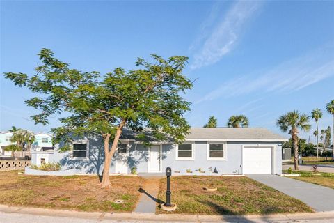Photo of 410 Virginia Avenue, Madeira Beach, FL 33708 (MLS # TB8391295)