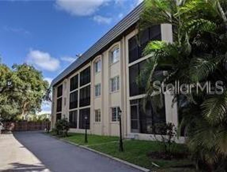 WEST of the Trail! Ground floor condo, offering quick and easy access to downtown Sarasota and Siesta Key. The enclosed lanai features vinyl windows and opens directly to the parking area, with your assigned space just steps away. Inside, the unit includes an in-home washer and dryer and a convenient Jack-and-Jill bathroom layout.