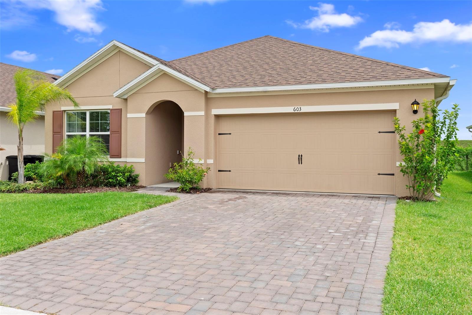 WOW – PRICED TO SELL! This is the lowest-priced home in all of Riviera Bella, DeBary’s most exclusive gated community, and we are offering $5,000 in closing concessions to use toward your closing costs or an interest rate buy-down. First-time homebuyers may also qualify for up to $35,000 through the Hometown Heroes program, making this one of the best deals in Central Florida. Welcome to 603 Lazio Circle, a stunning 3-bedroom, 2-bathroom, 2-car garage home that’s only two years old and feels brand new. Designed with modern upgrades and thoughtful touches, this home features high ceilings, custom accent walls, upgraded baseboards, recessed lighting, and a neutral designer color palette. The open floor plan offers a natural flow between the living room, dining area, and kitchen, creating a spacious feel while keeping each space beautifully defined. The kitchen features stainless steel appliances, granite countertops, 42-inch cabinetry, a custom backsplash, and a large island with bar seating, making it the perfect centerpiece for gatherings. The private owner’s suite offers a feature wall, tray ceiling, a large walk-in closet, and a spa-like ensuite with dual vanities, a soaking tub, and a separate walk-in shower. Two additional bedrooms share a stylish full bathroom, and the home also includes a dedicated laundry room and a two-car garage. Step outside to a covered lanai and low-maintenance yard, perfect for relaxing or entertaining. Riviera Bella delivers a luxury lifestyle with a private boat dock onto the St. Johns River for boating and fishing, a resort-style pool, fitness center, theater, multiple playgrounds, a splash pad, gated security, monthly food trucks, and exclusive year-round community events. This location offers incredible growth, with DeBary’s highly anticipated new downtown district currently under development, bringing new restaurants, shops, and entertainment just minutes away where you ride your Golf cart to. Less than two miles up the road, a brand-new 200+ acre state park is being built, offering miles of trails, outdoor recreation, and natural beauty. Also added is the Florida sun rail to get to Orlando and back for work on Ft Florida. Conveniently located near I-4, this home provides easy access to Orlando, Daytona Beach, shopping, and top-rated schools Debary elementary being A+ rated, while being tucked into a private, secure community. Don’t miss this rare opportunity to own a nearly new, move-in ready home in one of Central Florida’s fastest-growing areas. Schedule your private showing today!